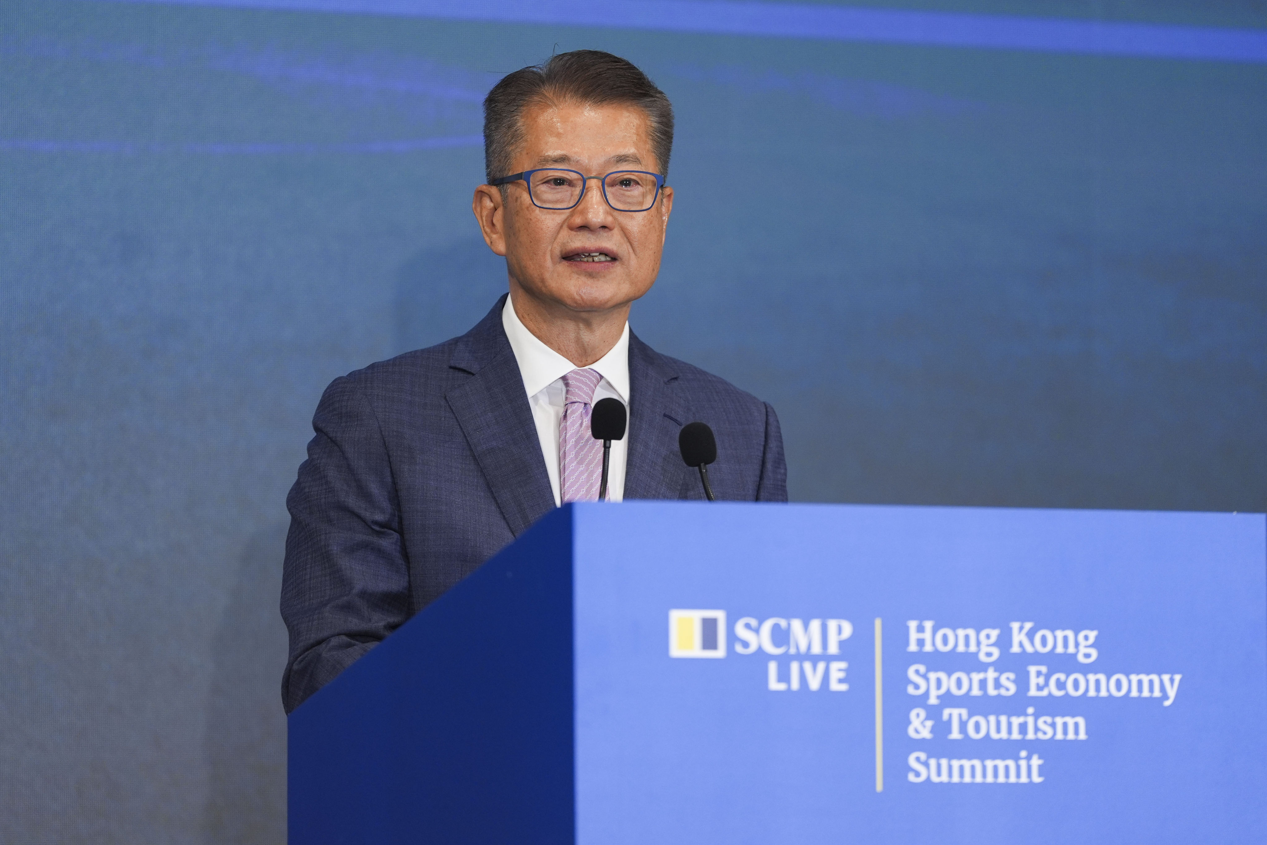 Financial Secretary Paul Chan delivers a keynote speech at the Hong Kong Sports Economy and Tourism Summit held at the Fullerton Hotel Ocean Park in Aberdeen. Photo: Eugene Lee