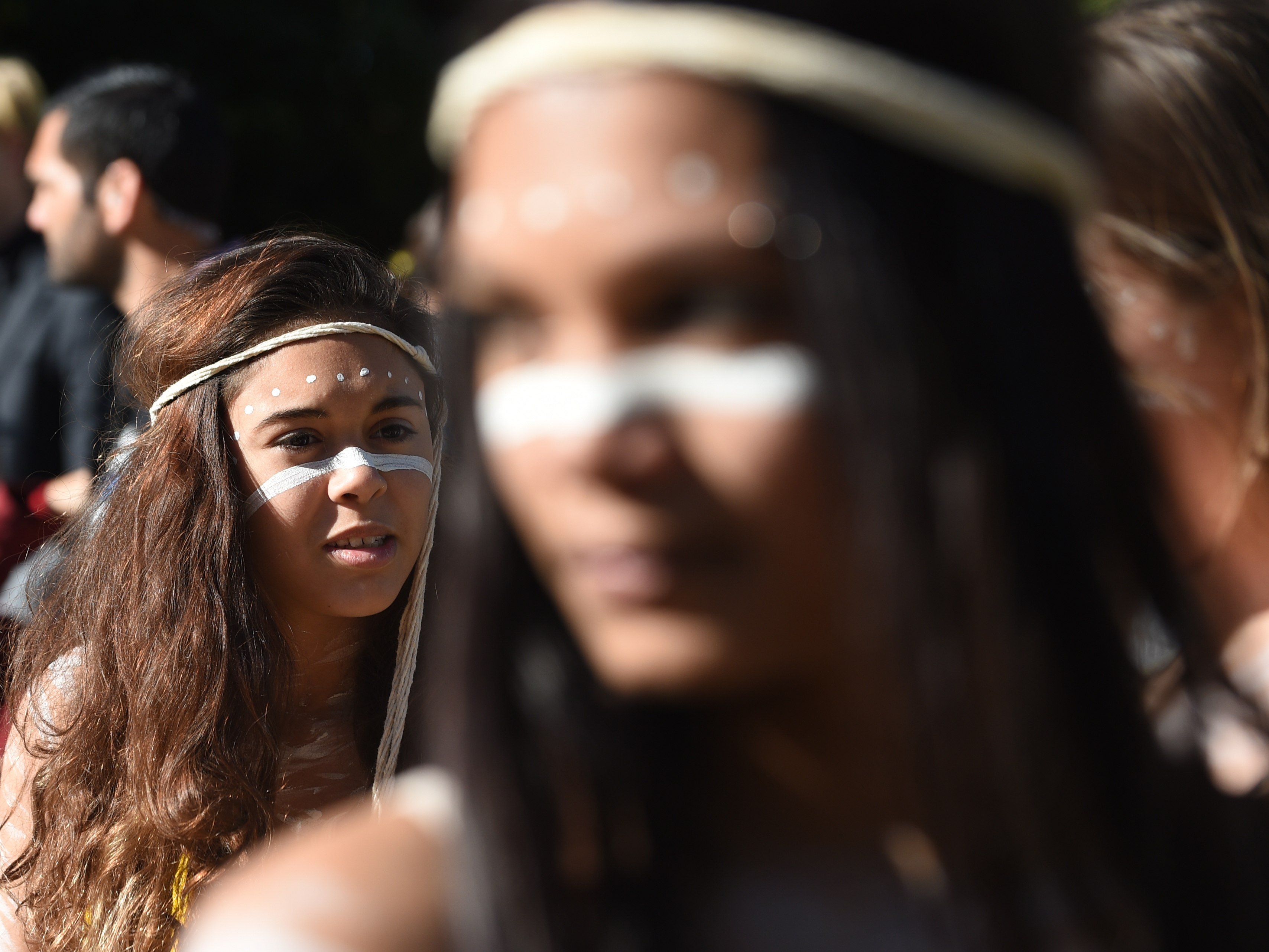 Indigenous Australian performers hold a smoking ceremony to open NAIDOC Week, a national programme that celebrates the National Aborigines and Islanders Day Observance Committee, in Sydney on July 6, 2015, which grew from the first political groups seeking rights for Aboriginal and Torres Strait Island Australians in the 1920s. Photo: AFP 