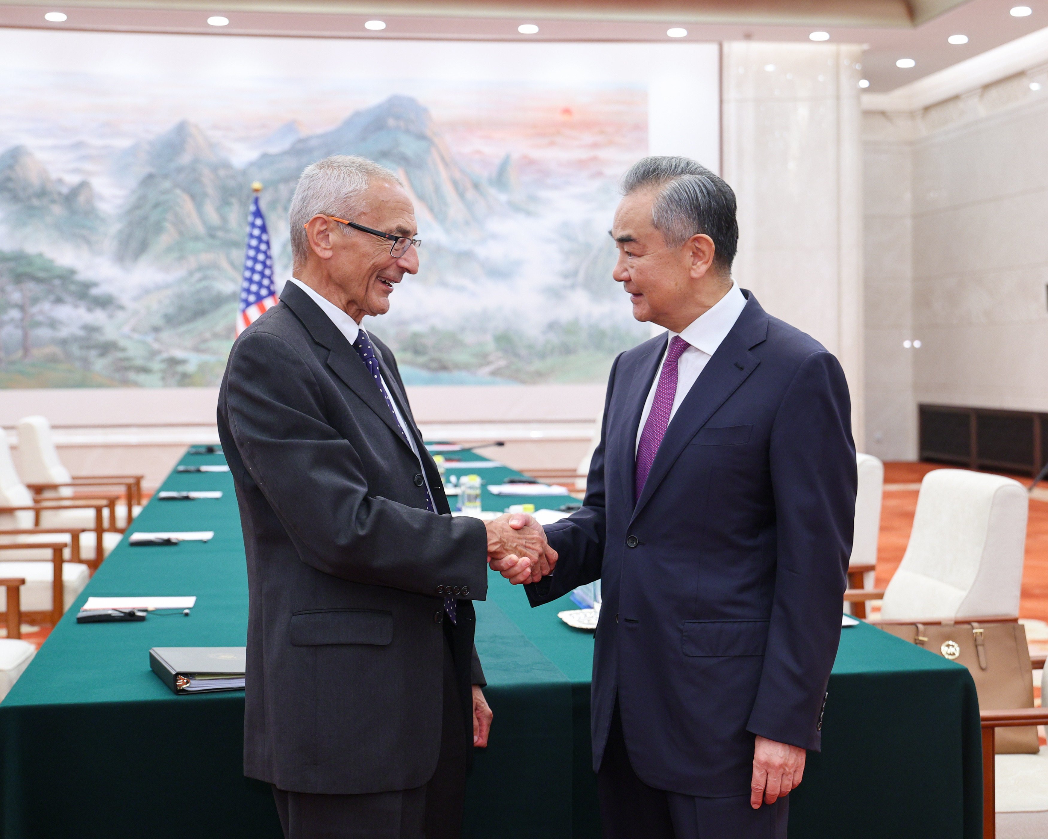 Chinese Foreign Minister Wang Yi (right) shakes hands with US climate envoy John Podesta in Beijing on Friday. Photo: Xinhua