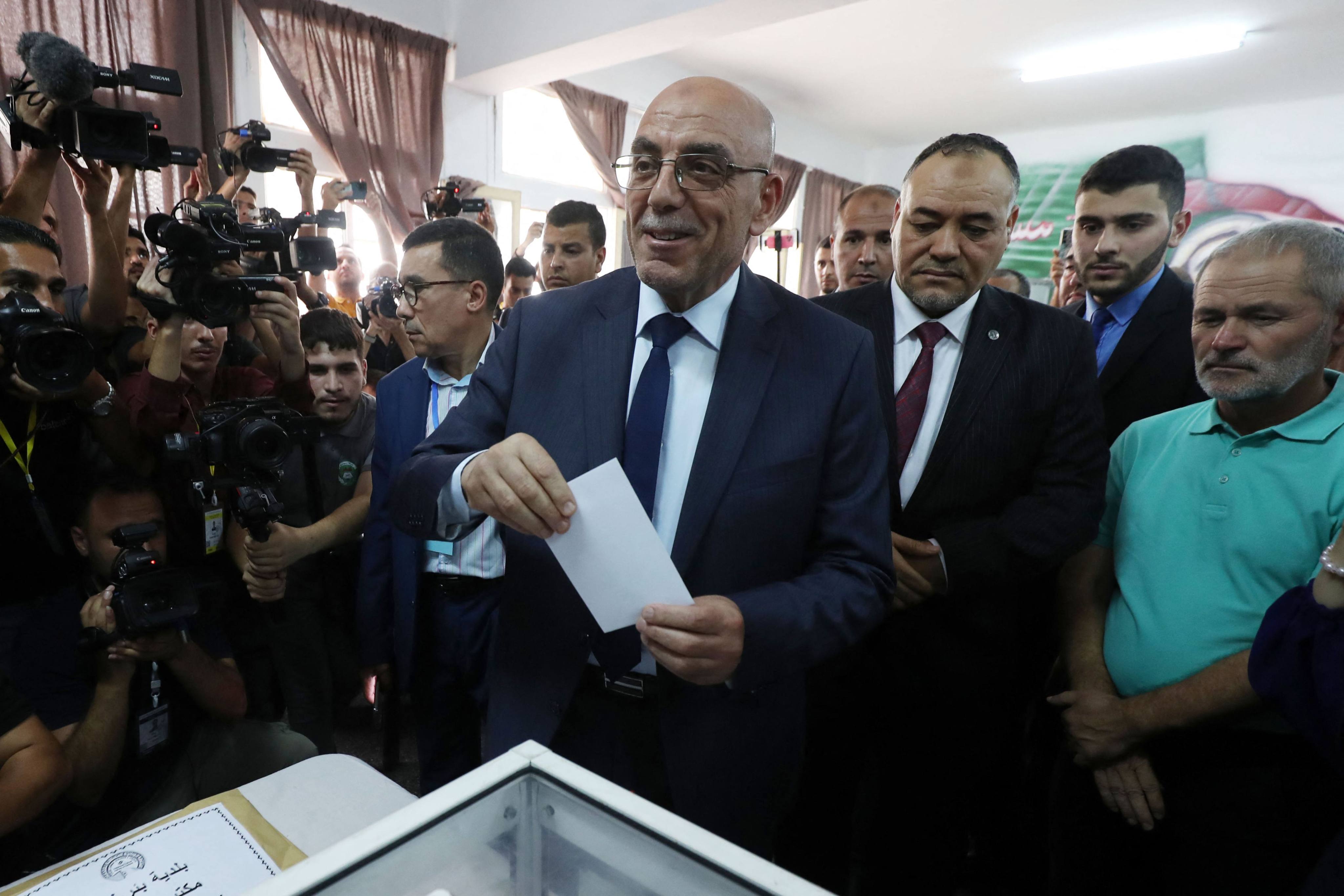 Algerian moderate Islamist Abdelaali Hassani votes at a polling station during the presidential election, in Algiers on Saturday. About 24 million Algerians are eligible to vote on September 7, with experts saying incumbent President Abdelmadjid Tebboune faces no real risk to his tenure as he seeks a second term. Photo: AFP