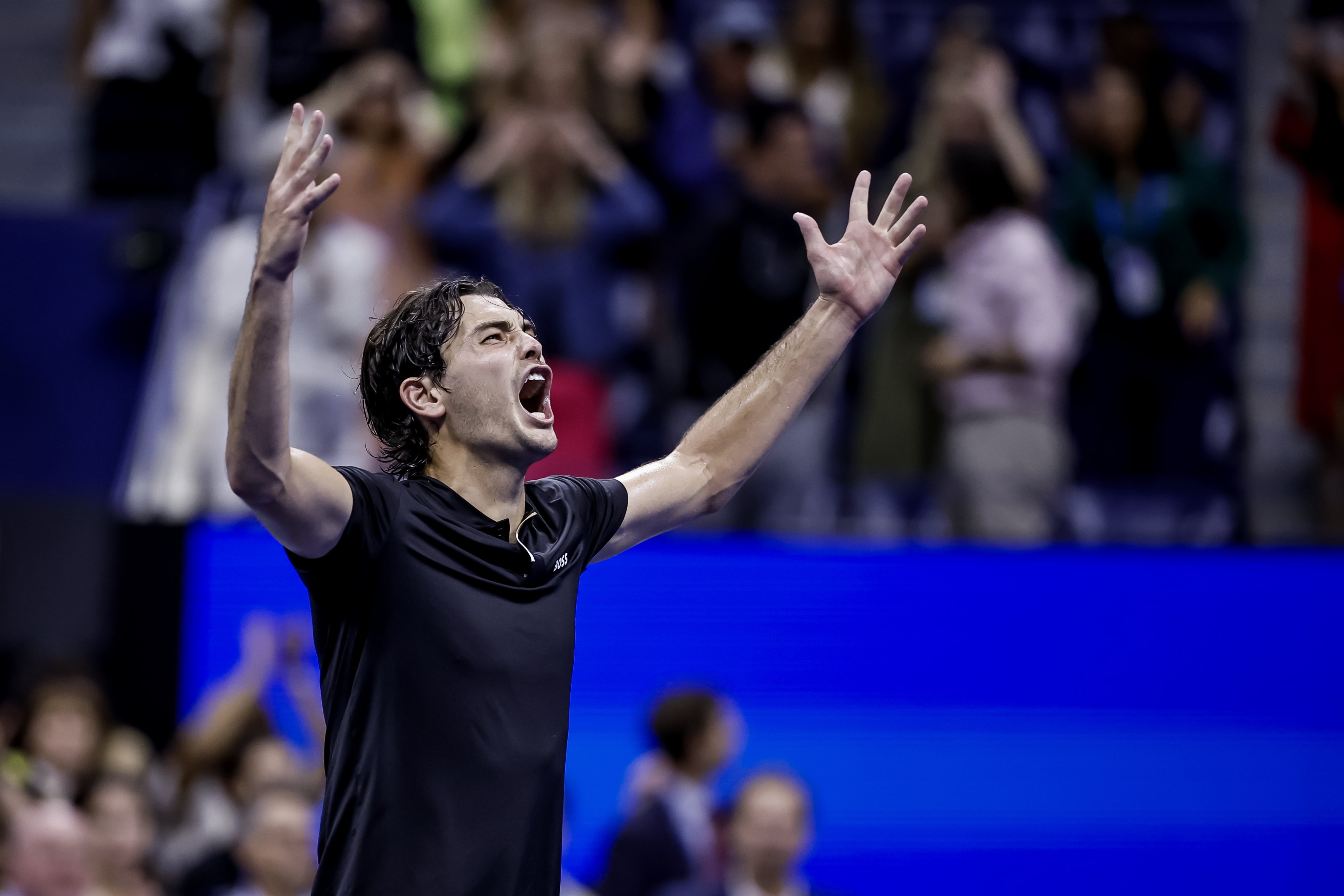 Taylor Fritz celebrates after victory over Frances Tiafoe as he becomes the first American man since Andy Roddick to reach the US Open final. Photo: EPA