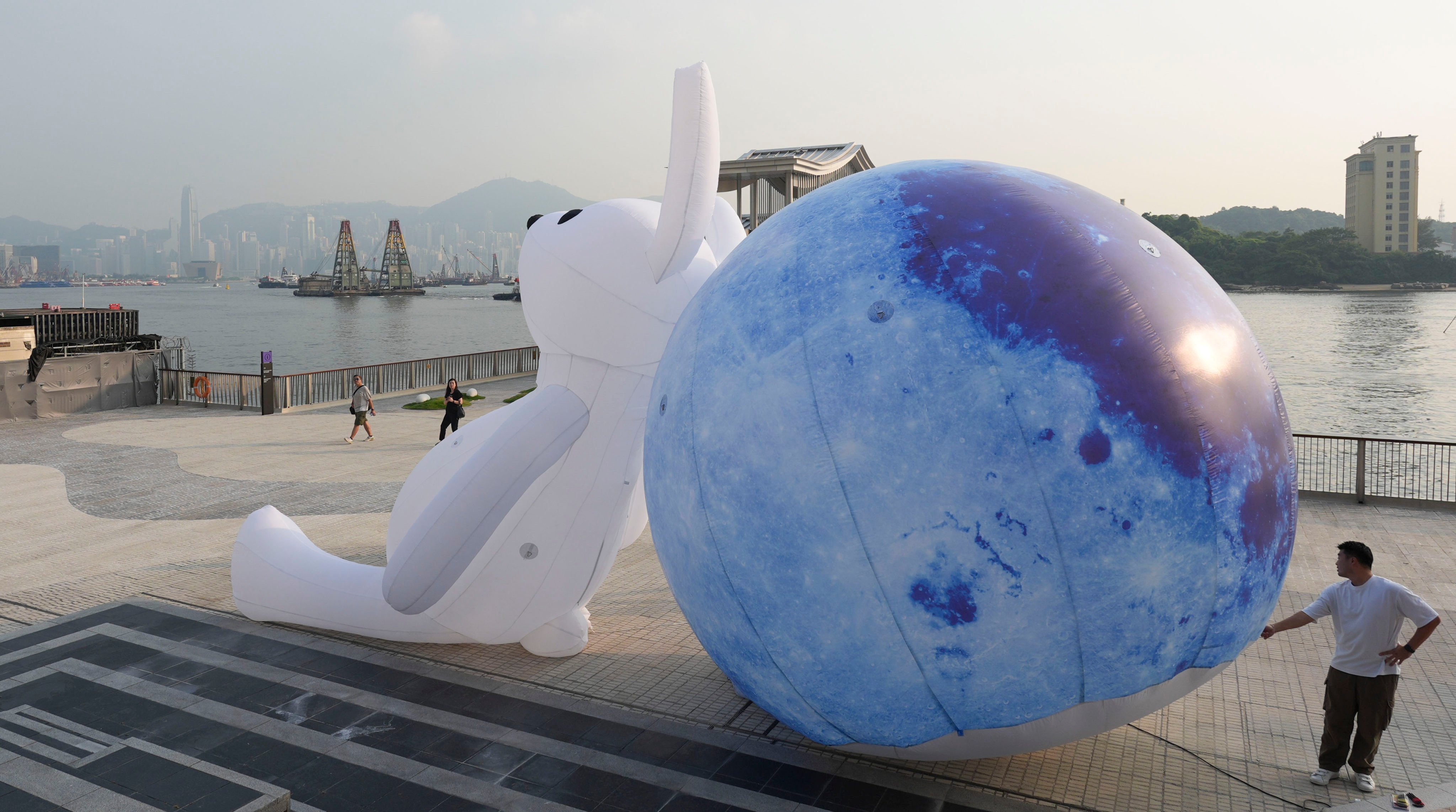 A worker tests a large inflatable Mid-Autumn Festival decoration at Cheung Sha Wan Promenade. Eugene Lee