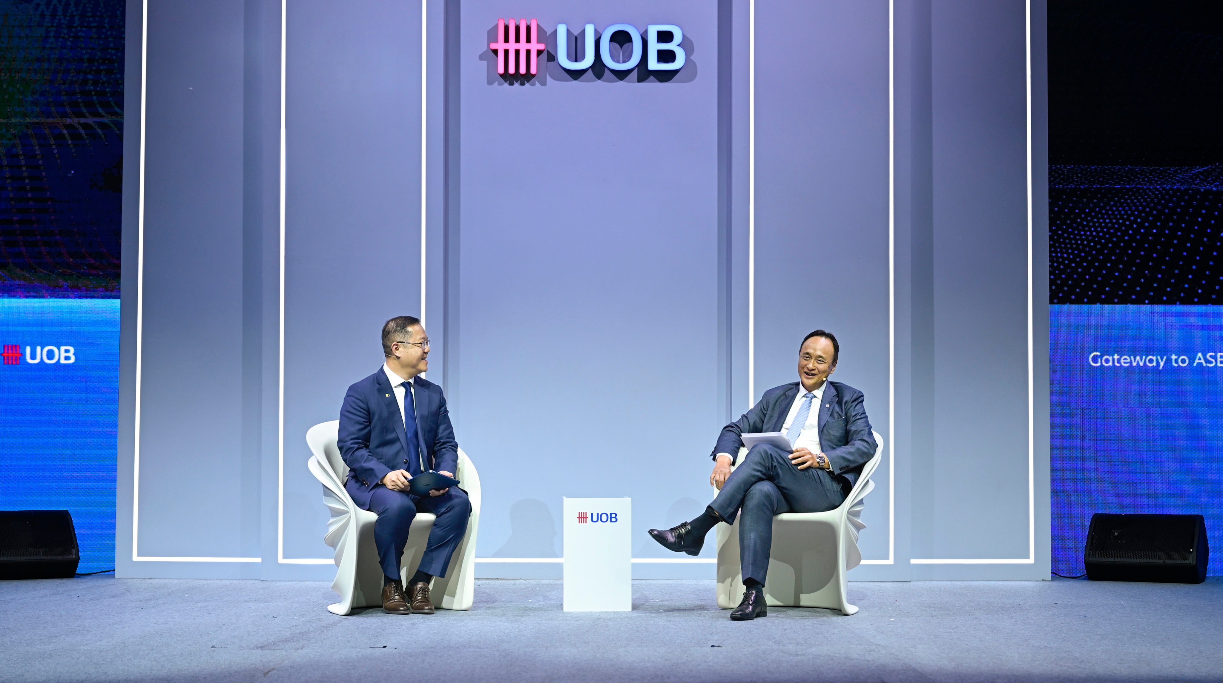 Chin (right) discusses the regional trade outlook with Kevin Huang, COO of SCMP, at the UOB Gateway to Asean Conference in Ho Chi Minh City last week. Photo: Handout