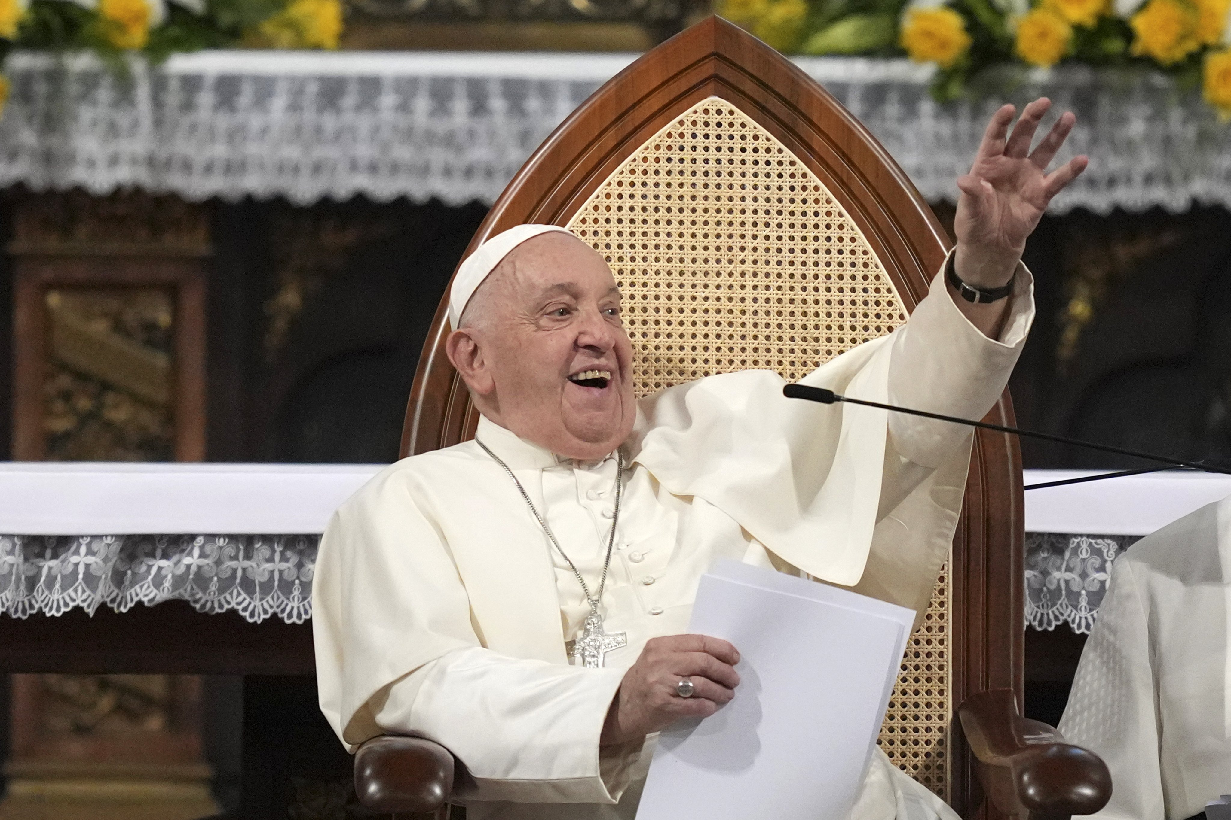 Pope Francis waves to members of the Catholic community at a cathedral in Jakarta last week. The pontiff is set to arrive in Singapore on Wednesday. Photo: EPA-EFE