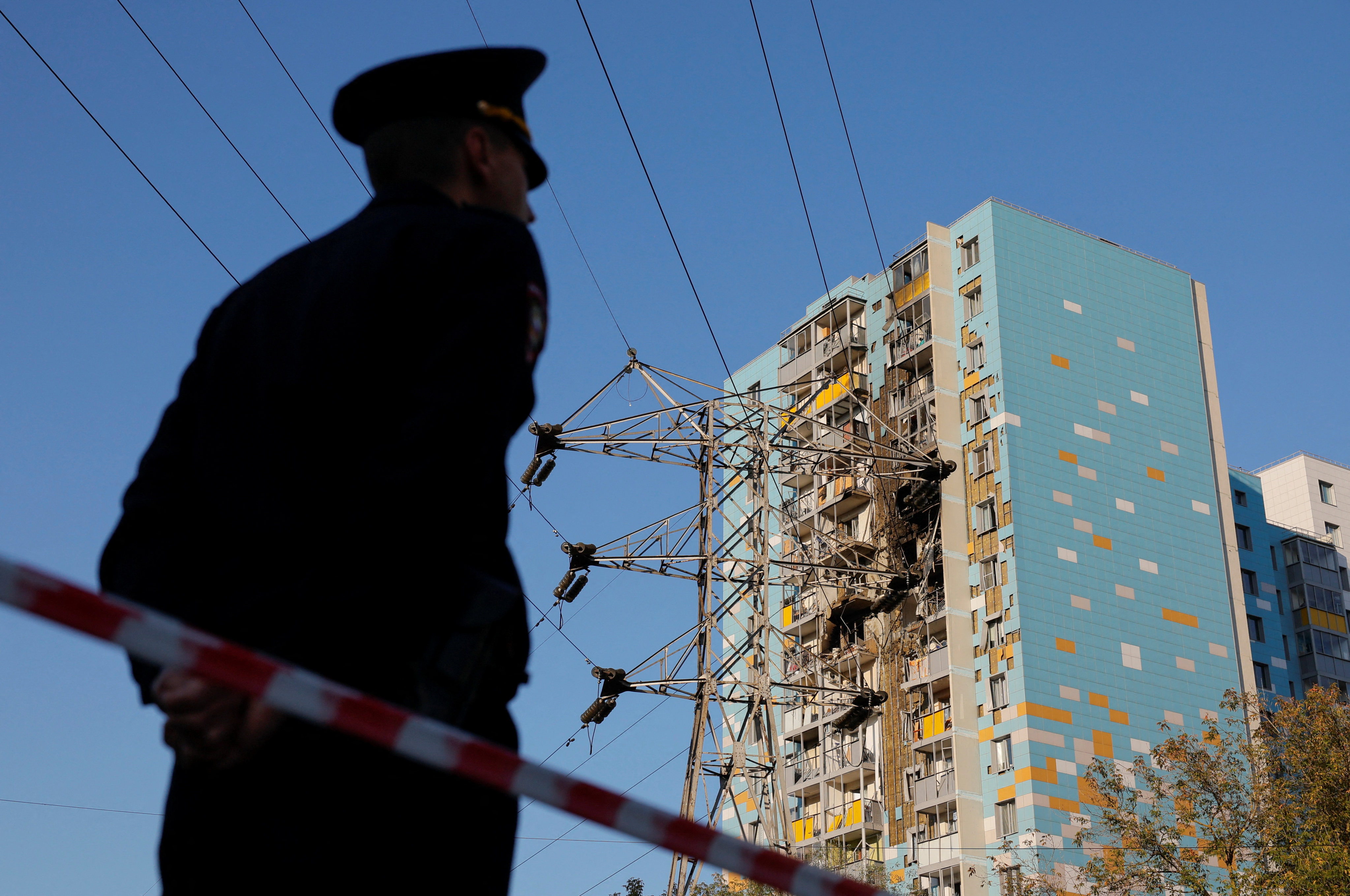 A security guard watches over a housing project in China. Photo: Reuters