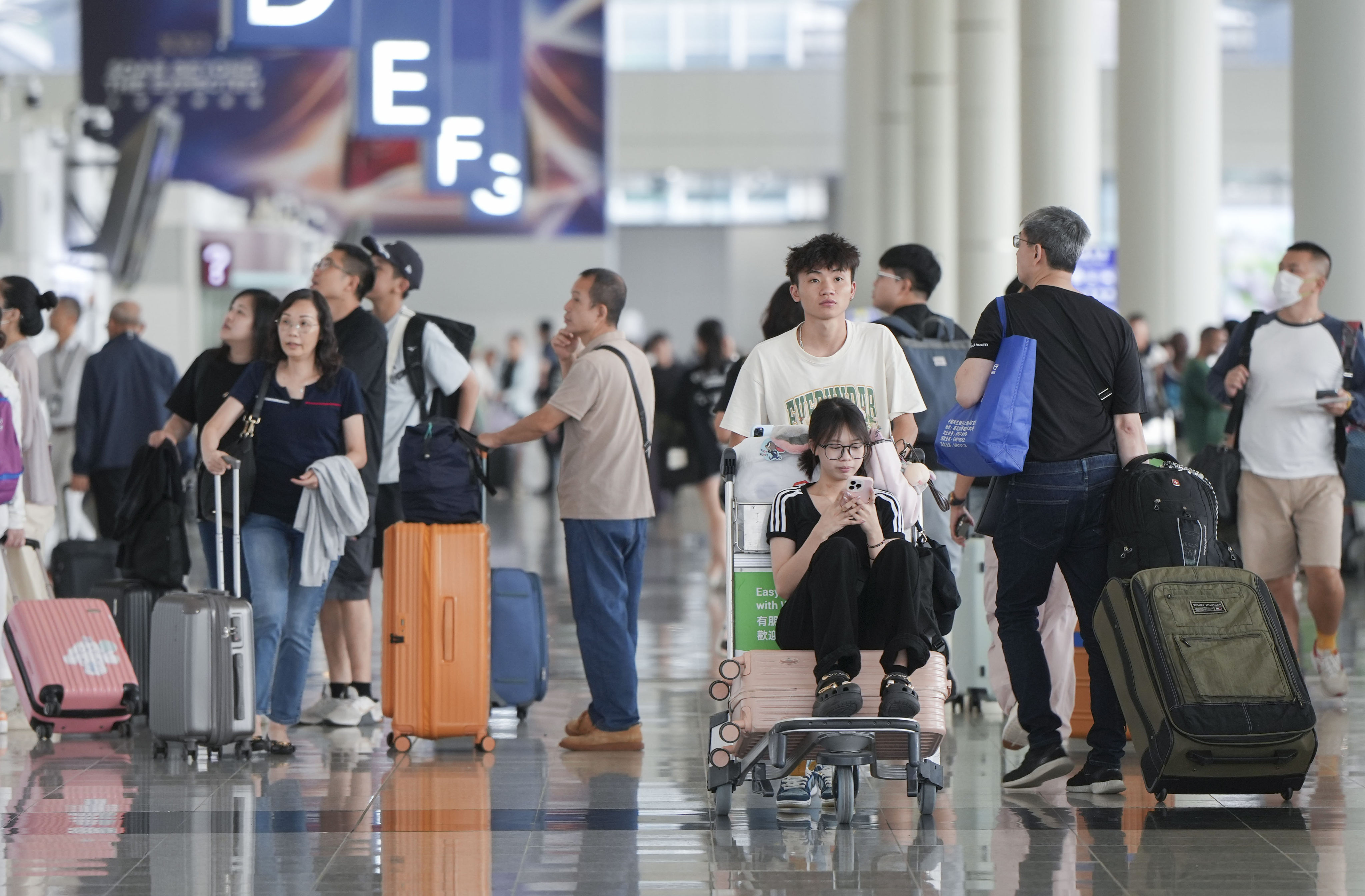 Passengers walks in the departure hall of Hong Kong International Airport. Photo: Sam Tsang