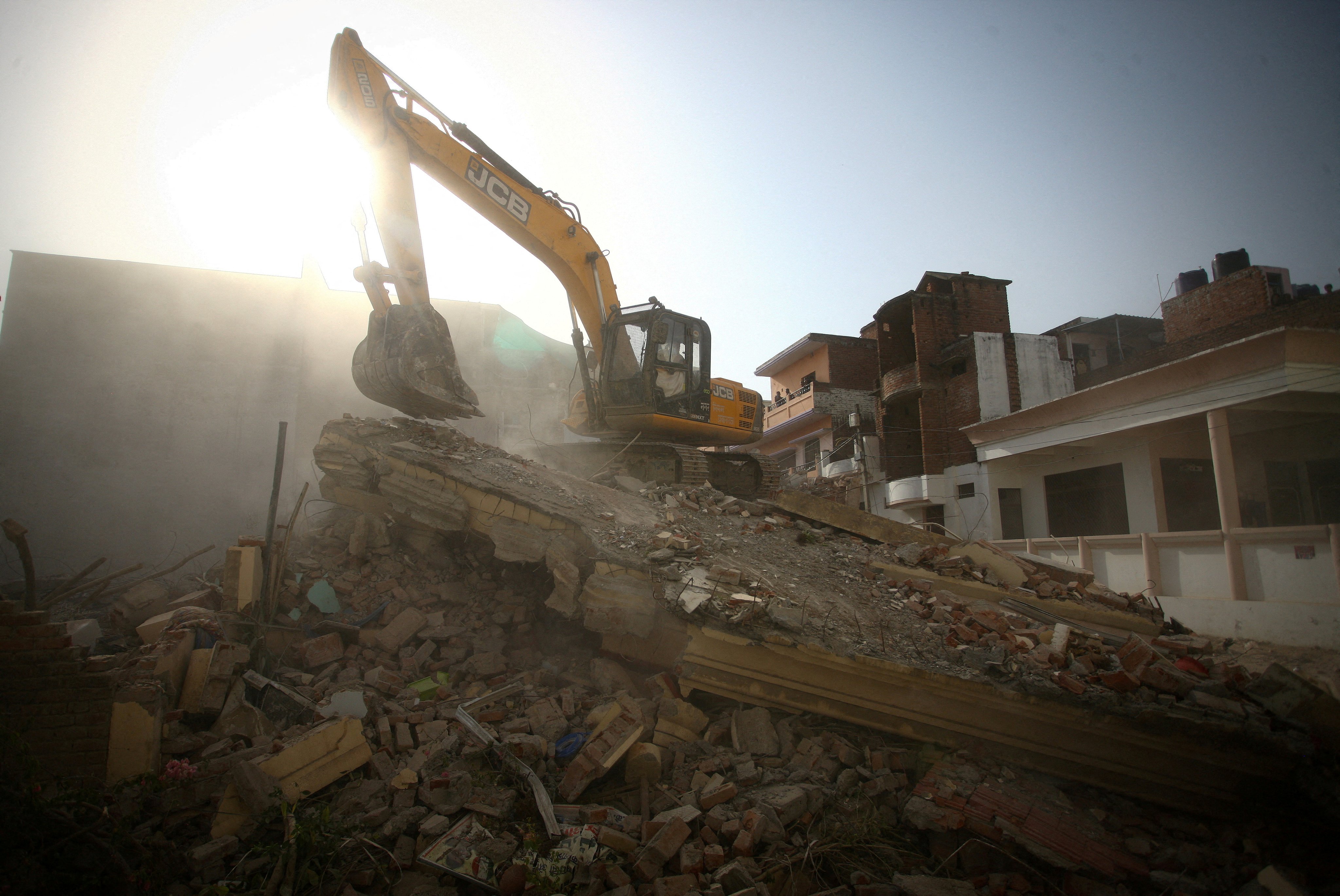 A bulldozer demolishes the house of a Muslim man in India’s Uttar Pradesh state in 2022. Photo: Reuters