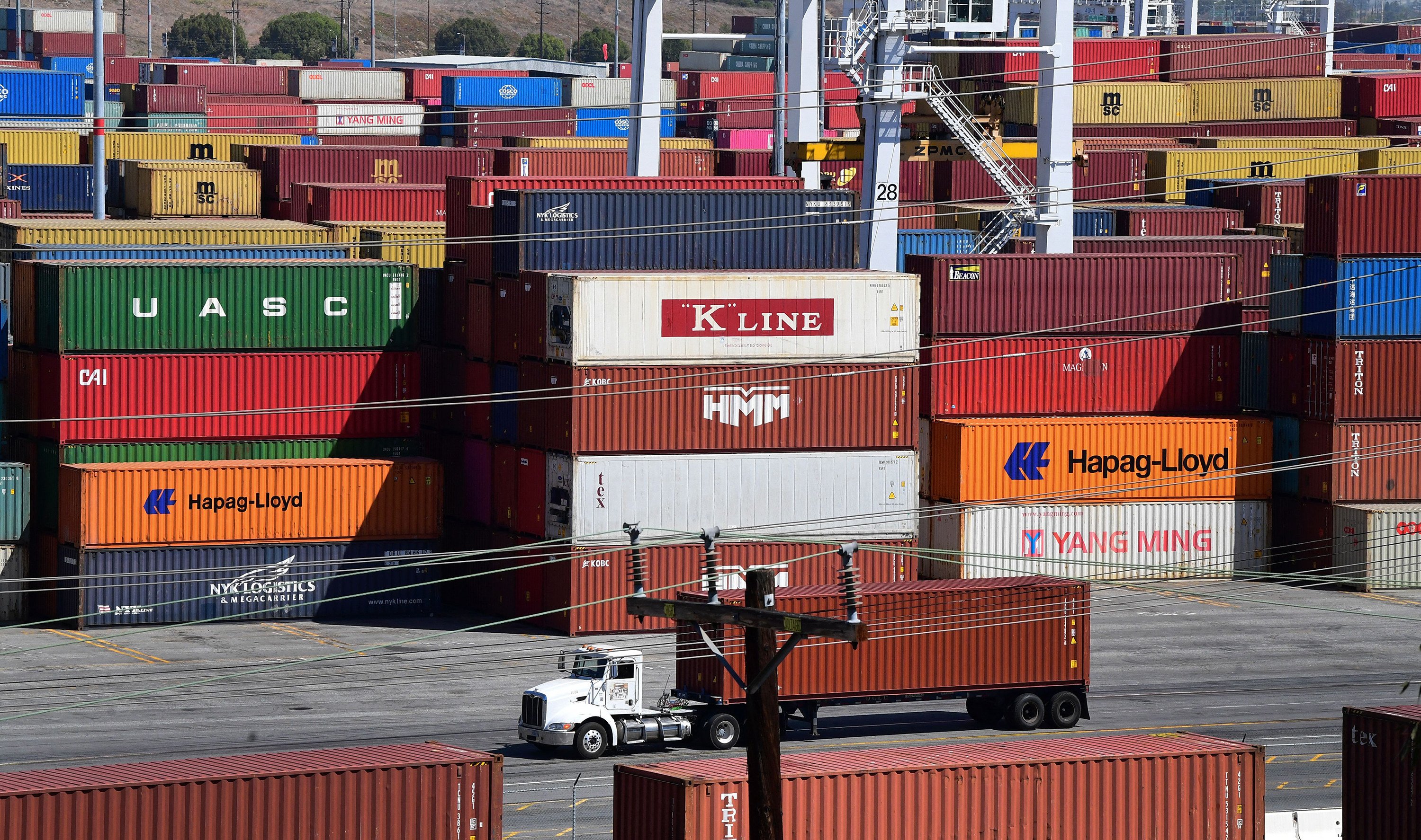 Shipping containers are stacked high at the Port of Los Angeles. Photo: TNS