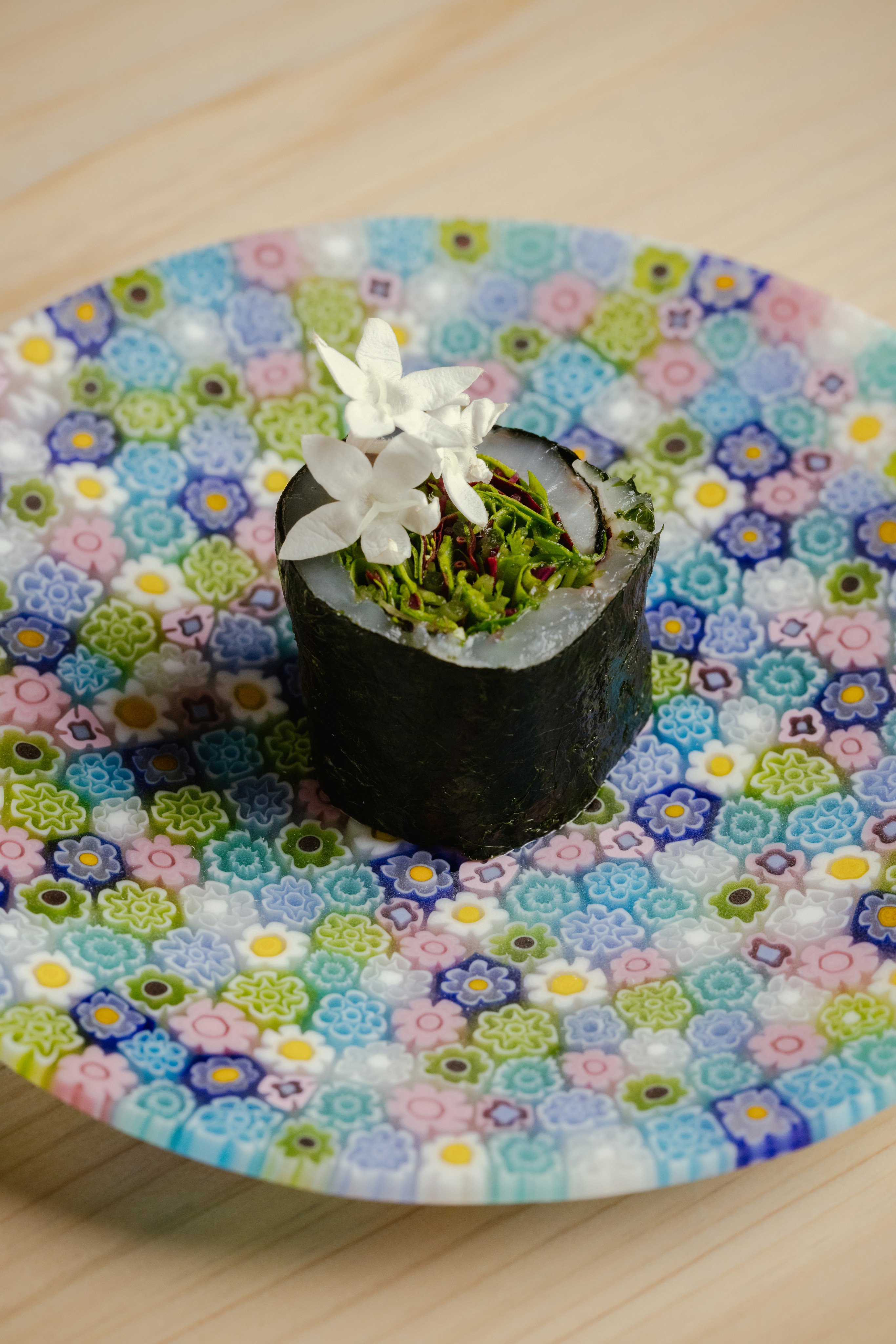 A maki roll at Udatsu Sushi uses fresh herbs to wrap the fish. Photo: Nicholas Wong/Sixteen Photography