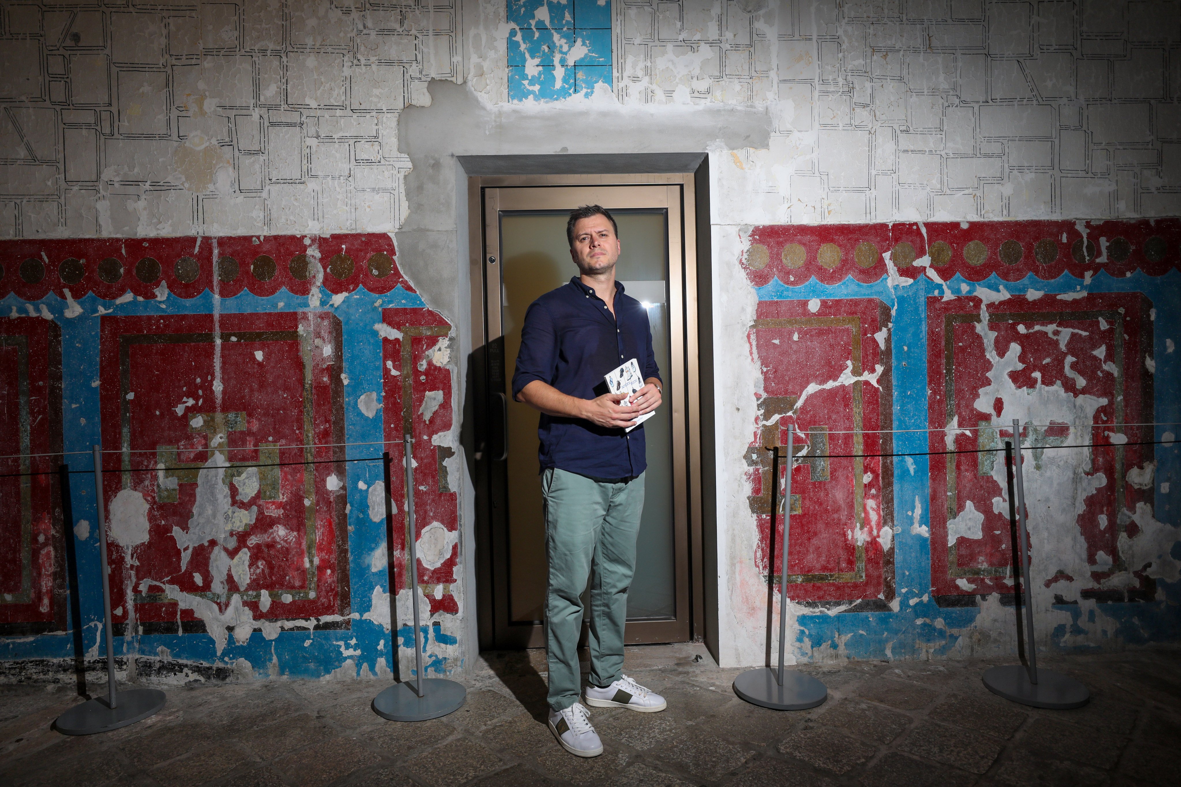 Daniel Bird holds a copy of his new book Sorry Men at Tai Kwun in Central, Hong Kong. Photo: Xiaomei Chen