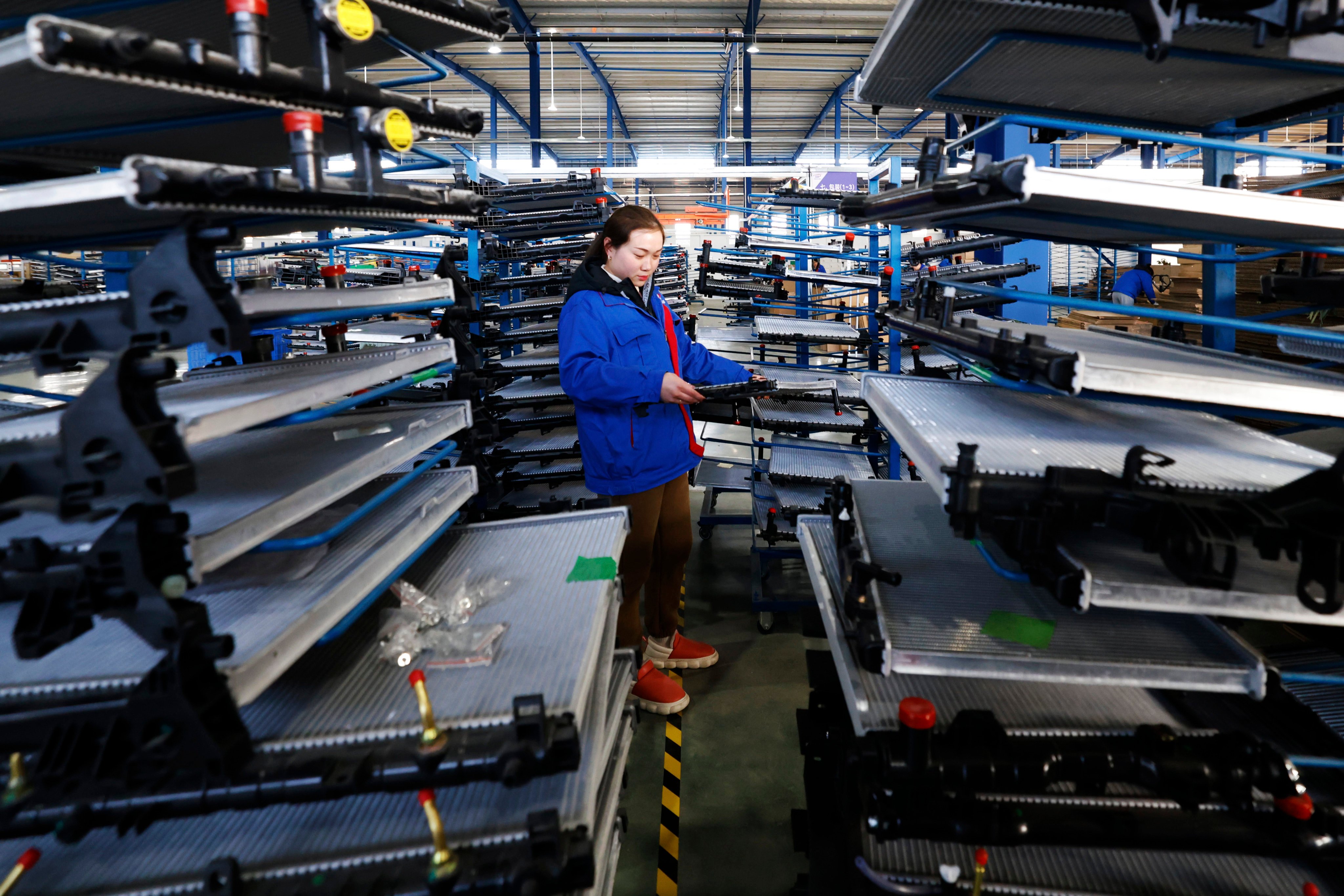 An employee works at an automotive-parts workshop in China’s Jiangsu province earlier this year. A survey has found that European Union firms operating in the country are most pessimistic about the automotive sector. Photo: Getty Images