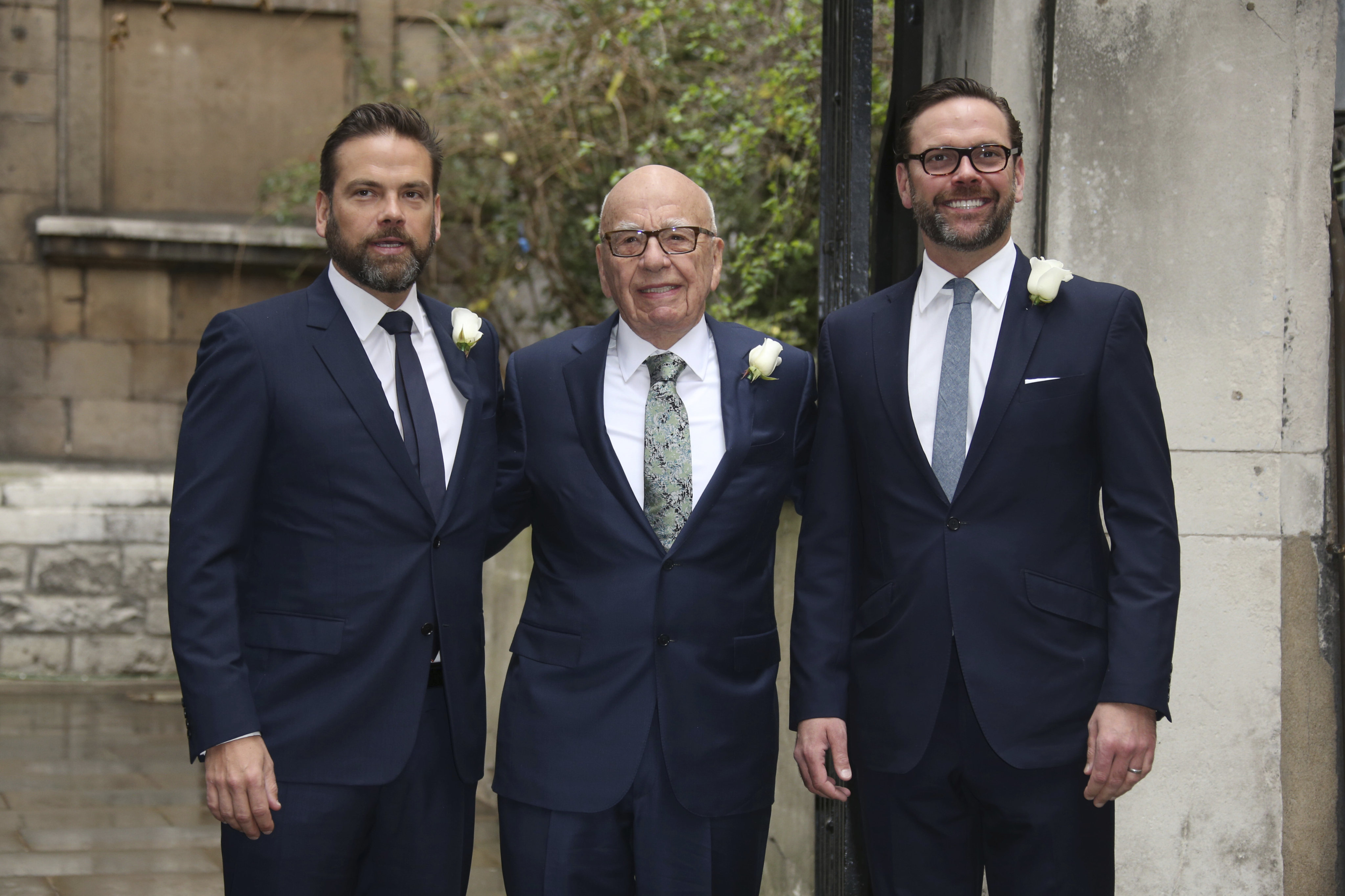 Rupert Murdoch with his sons Lachlan (left) and James (right) in London. Photo: AP