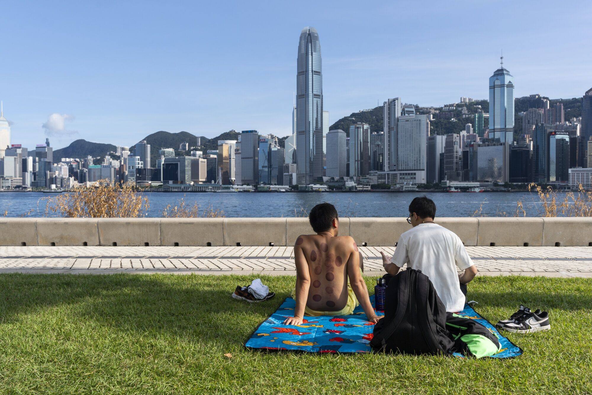 People viewed the skyline of Hong Kong Island from the West Kowloon Cultural District. Photo: Bloomberg