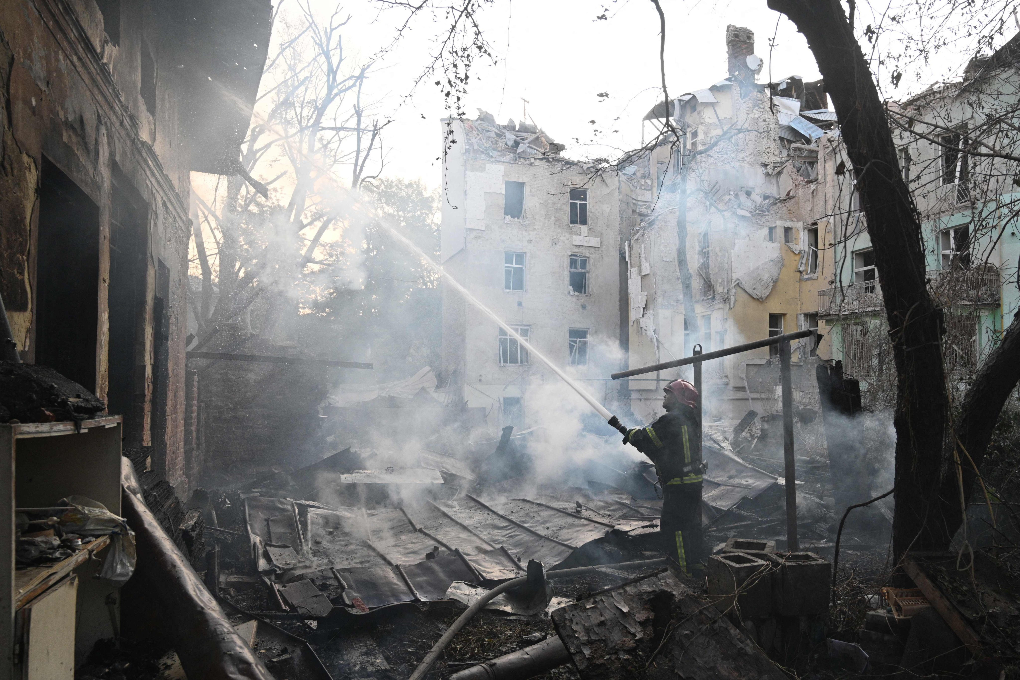 Ukrainian rescuers try to extinguish a fire following a missile attack in the city of Lviv last week. Russia invaded Ukraine in February 2022, and the two countries have been at war ever since. Photo: AFP