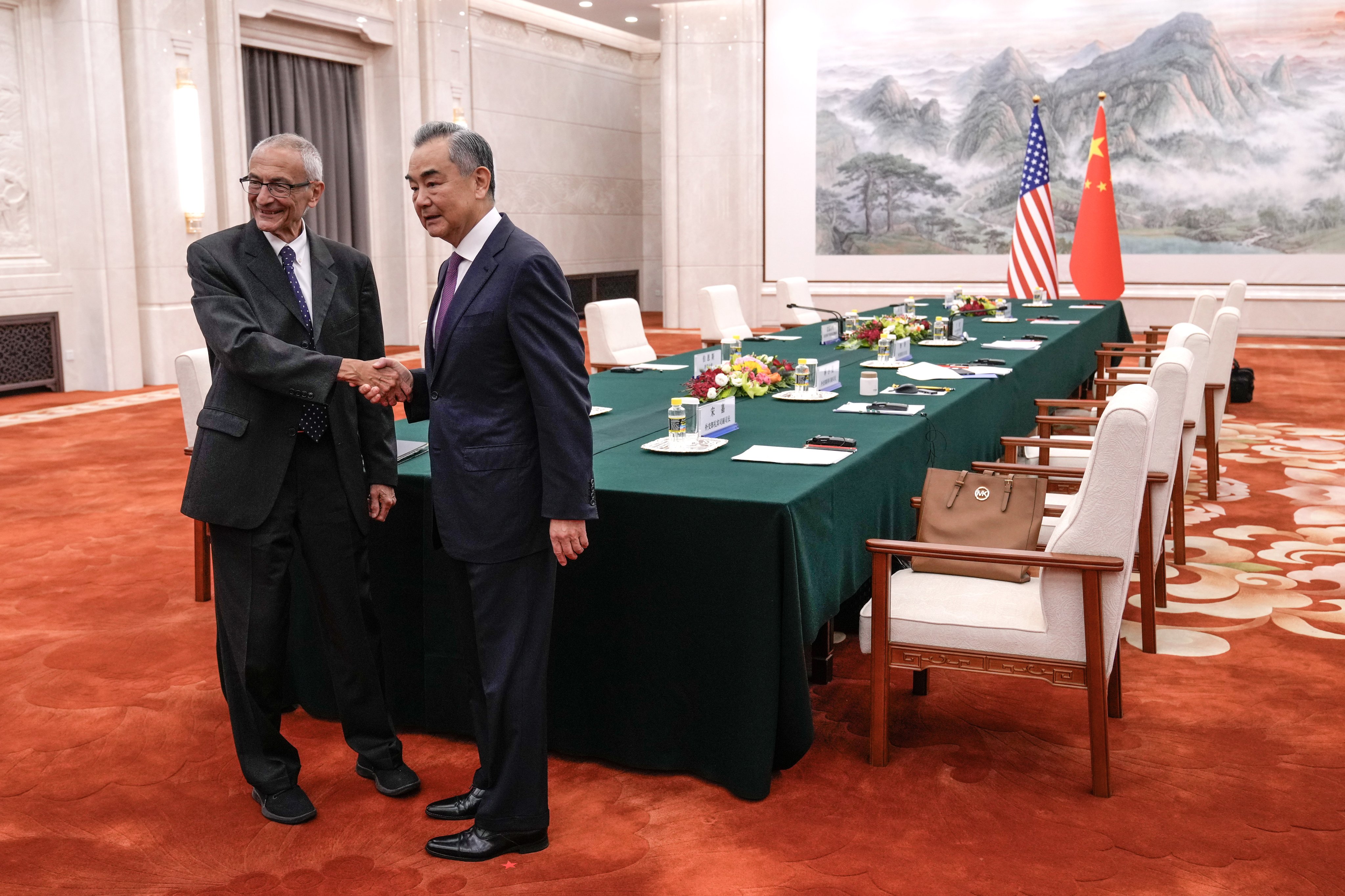 US senior adviser and climate envoy John Podesta (left) shakes hands with Chinese Foreign Minister Wang Yi during their climate talks, at the Great Hall of the People in Beijing on September 6. As the US and China try to cooperate on myriad issues while maintaining their respective stances in numerous disputes, it becomes evident that bureaucracy as a Track 1 dialogue is inherently limited in achieving desirable outcomes. Photo: EPA-EFE / Pool