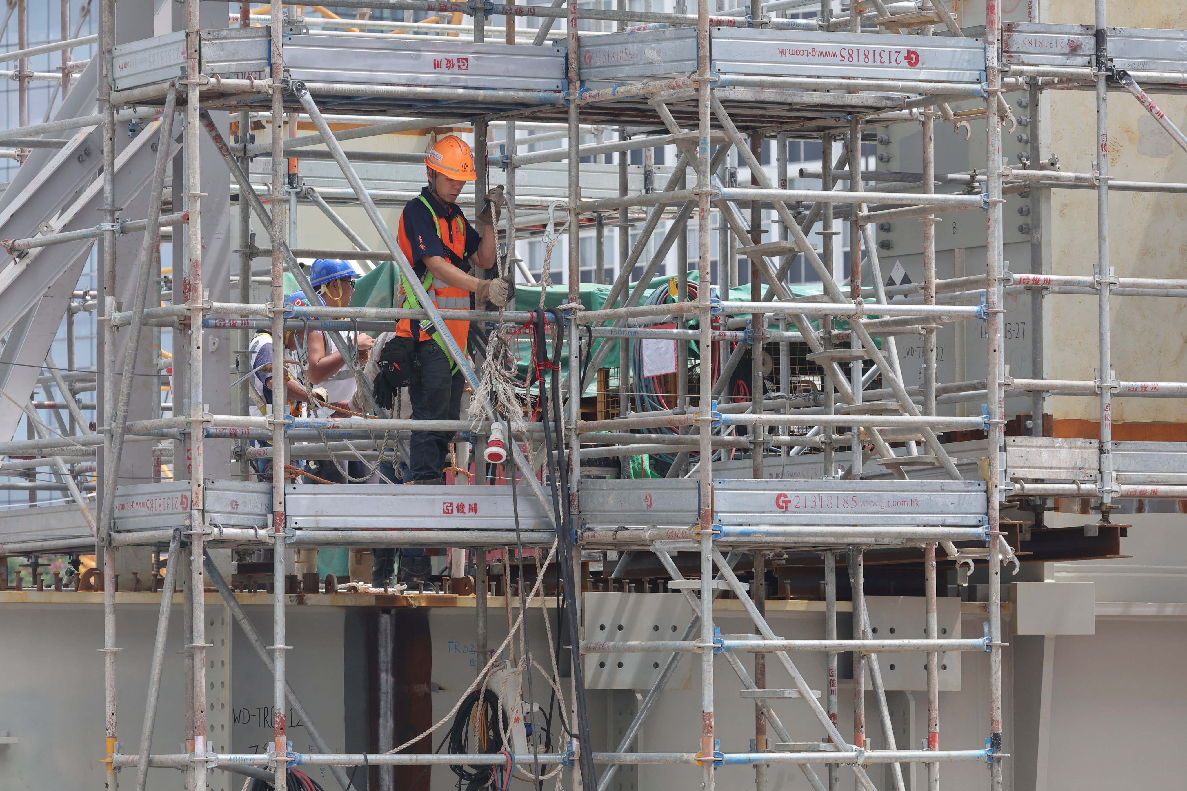 Construction workers labour on a site in Central on September 7, 2024. Photo: Edmond So