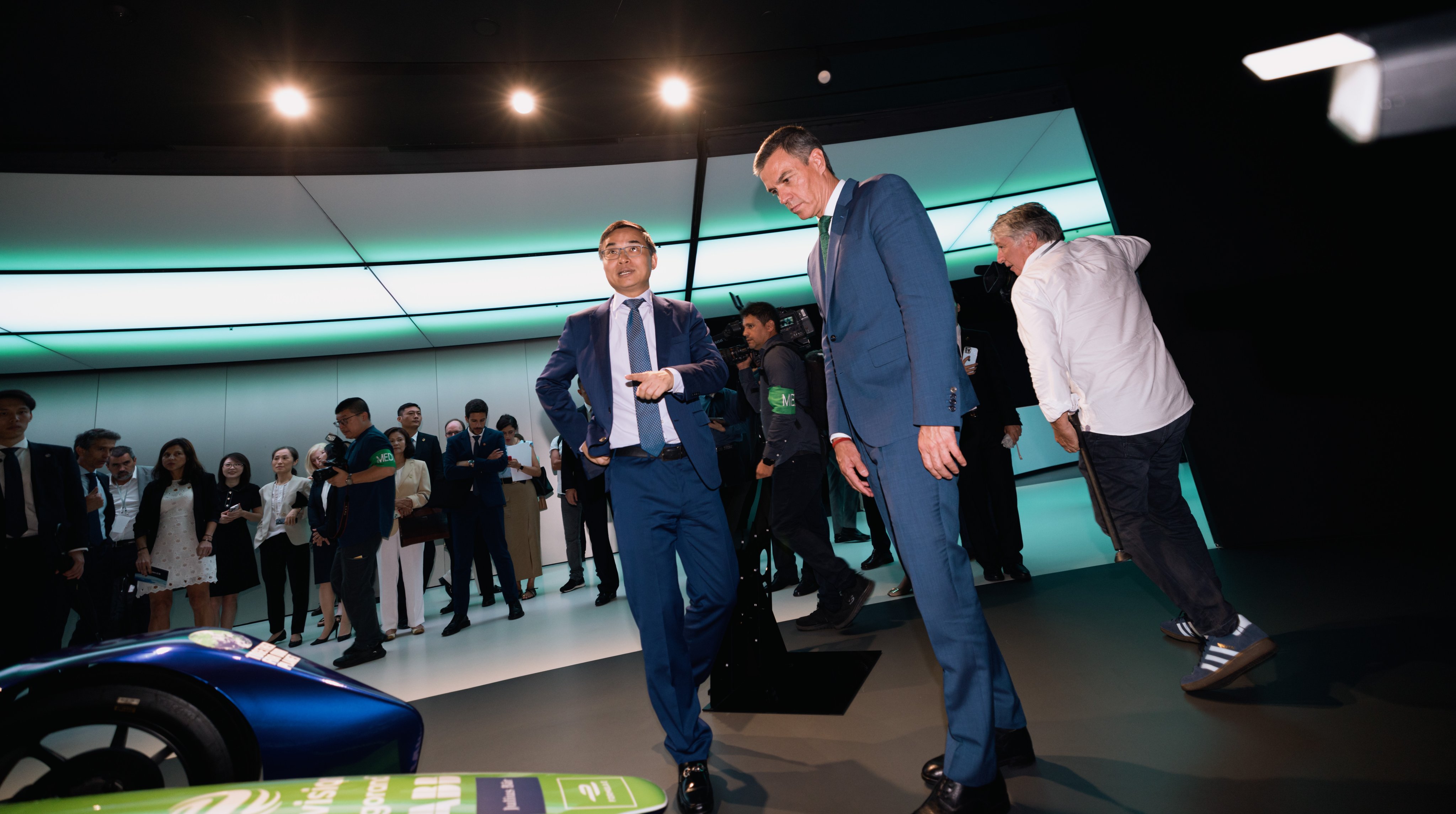 Spain’s Prime Minister Pedro Sanchez (centre) looks at Formula e-cars during a visit to Envision in Shanghai. Photo: EPA-EFE