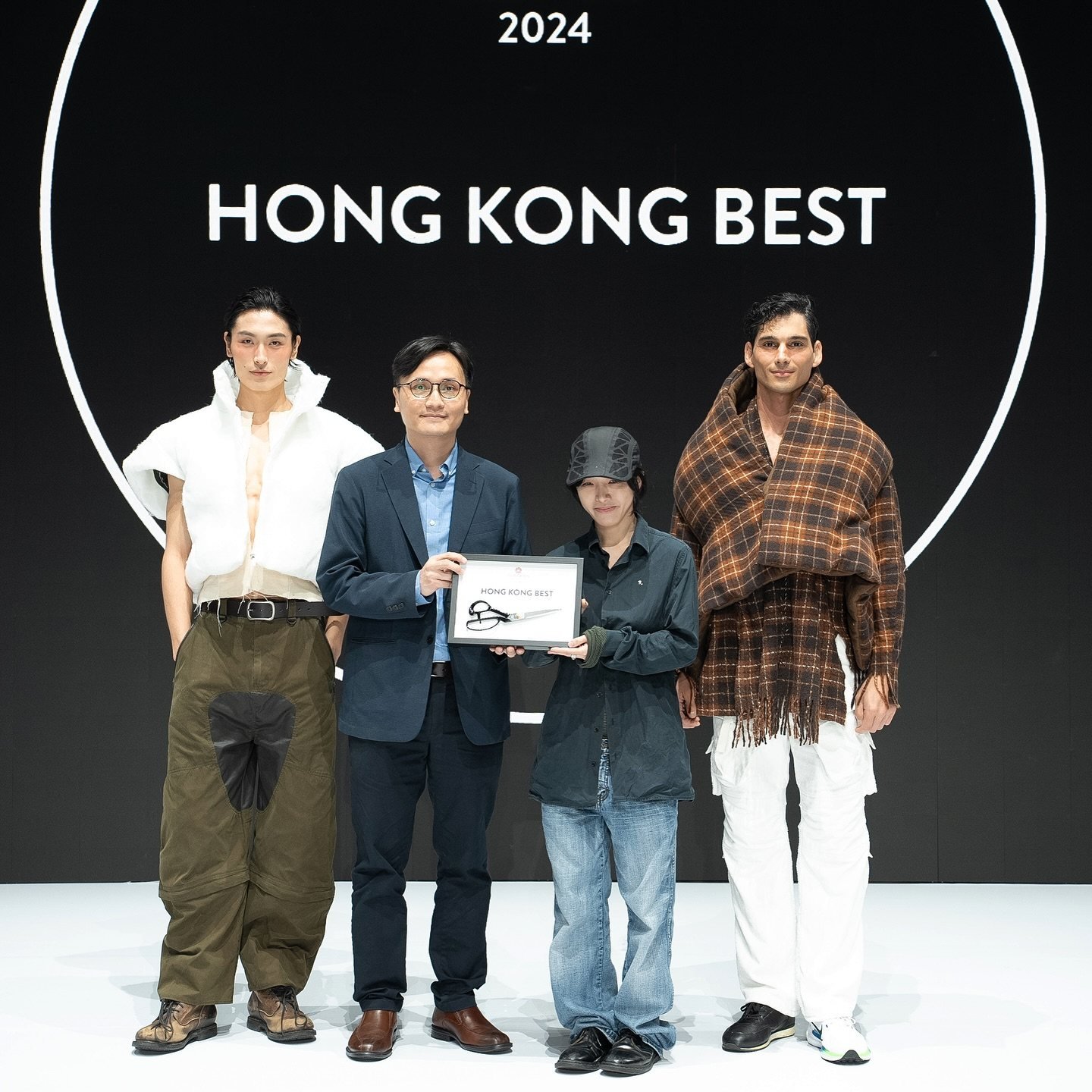 Tiger Chung (second from right) accepts the grand prize at the Redress Design Award 2024. Photo: Redress