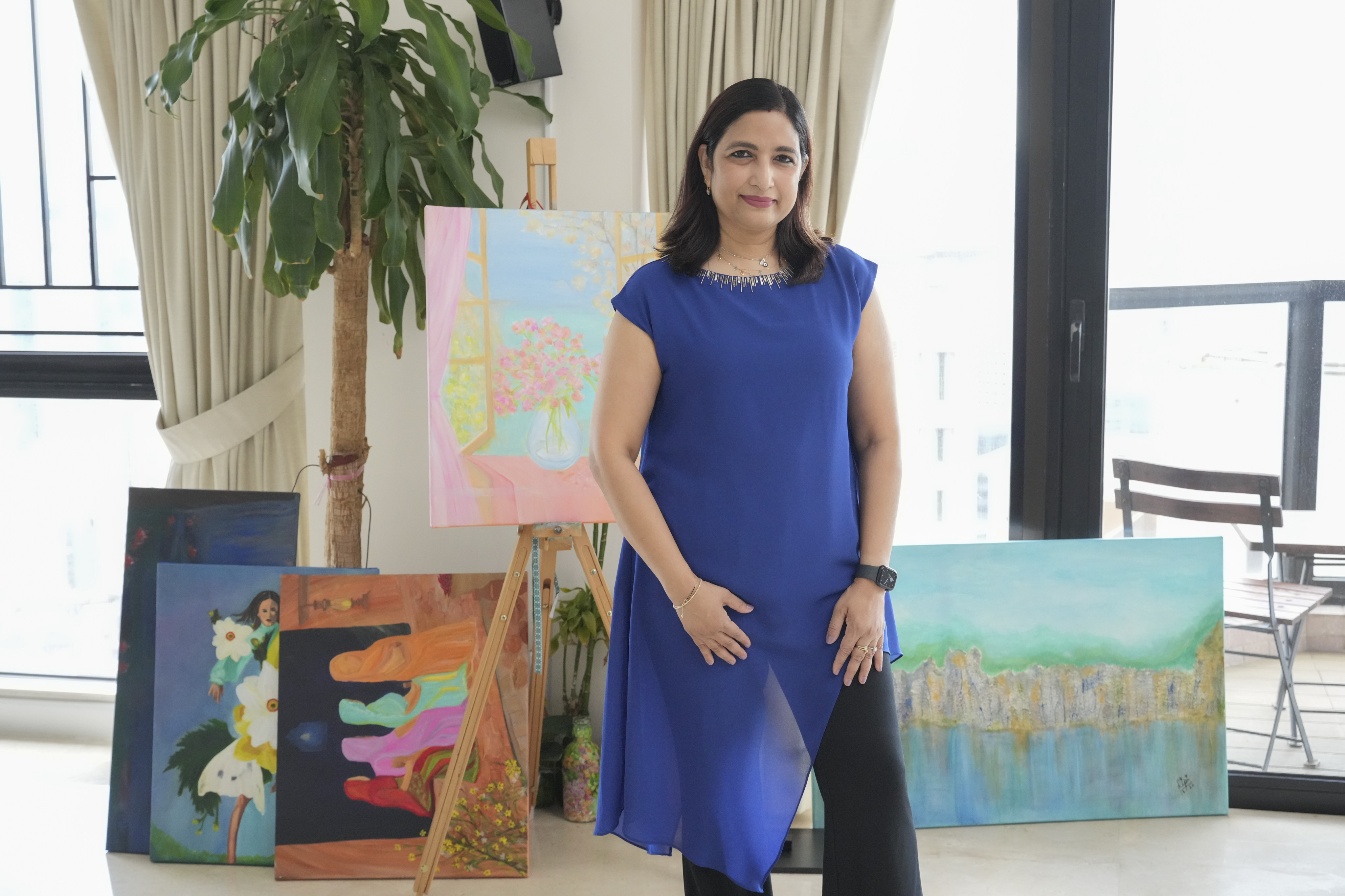 Lipi Srivastava with a collection of her paintings at her home in Hong Kong. Photo: May Tse