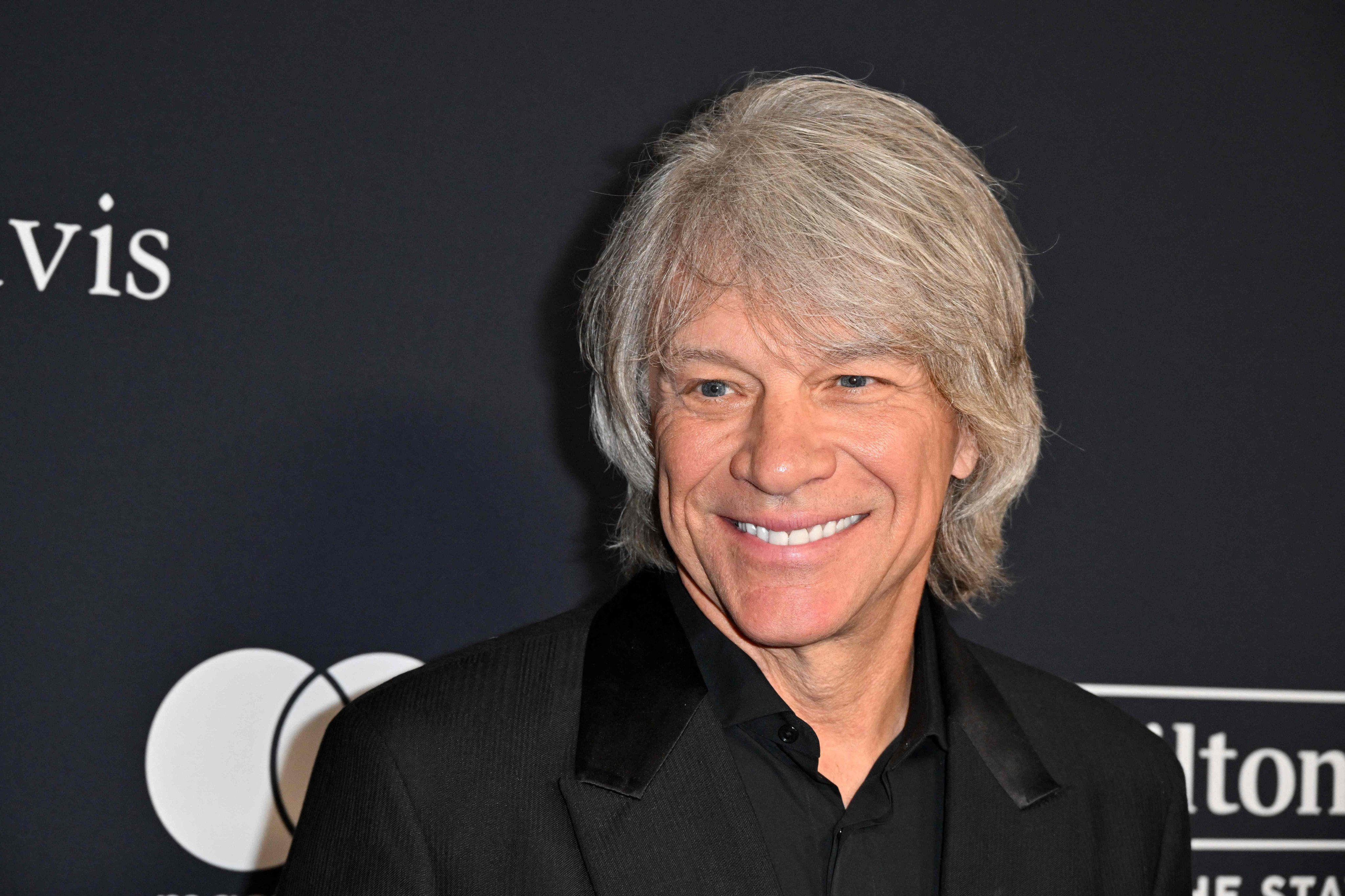 Grammy-winning rocker Jon Bon Jovi was shooting a video on Tuesday on the John Seigenthaler Pedestrian Bridge in Nashville when he and another person saw a woman standing outside the guard railing of the bridge and helped her to safety. Photo: AFP