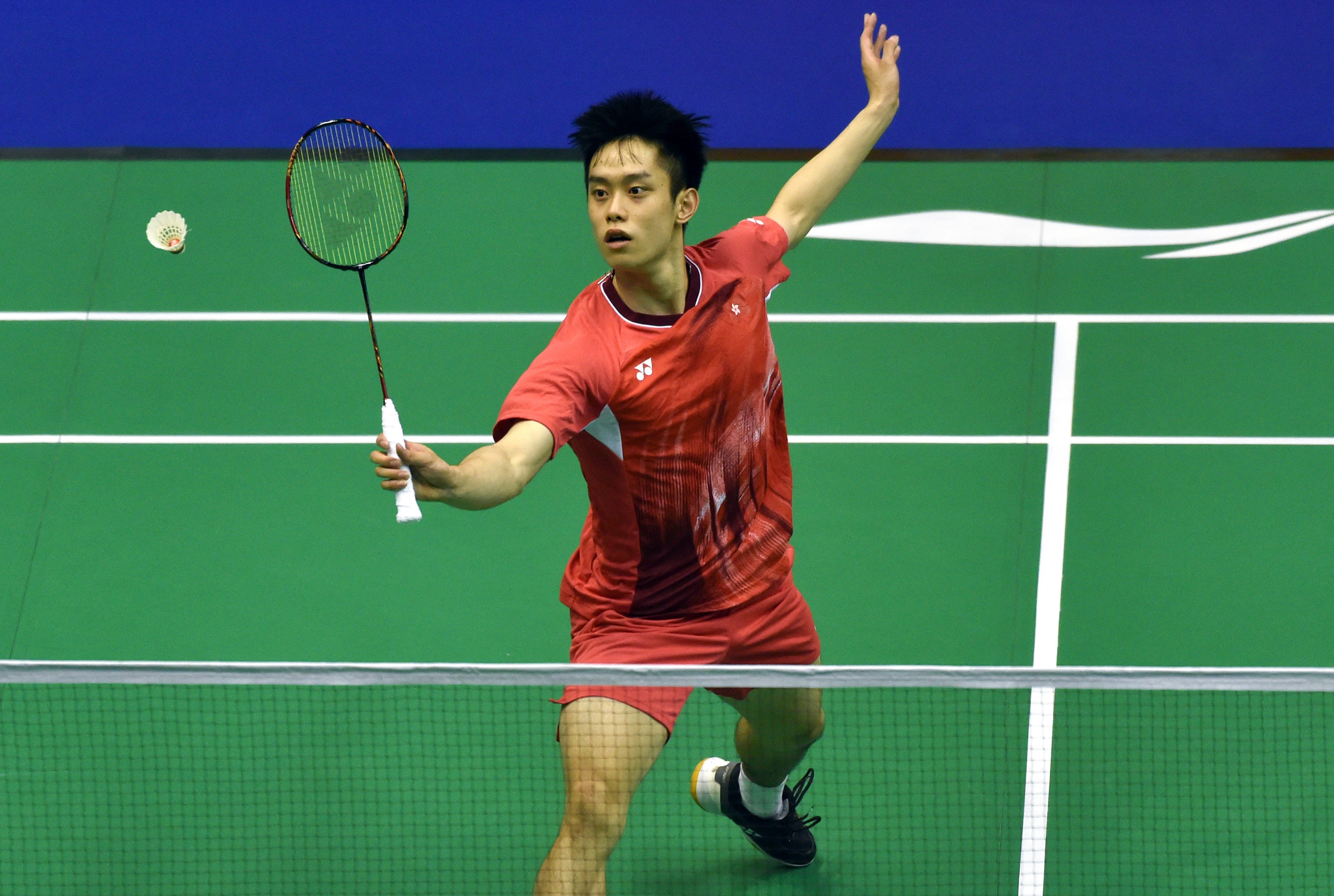 Jason Gunawan of Hong Kong hits a return against Christo Popov on Thursday. Photo: Xinhua