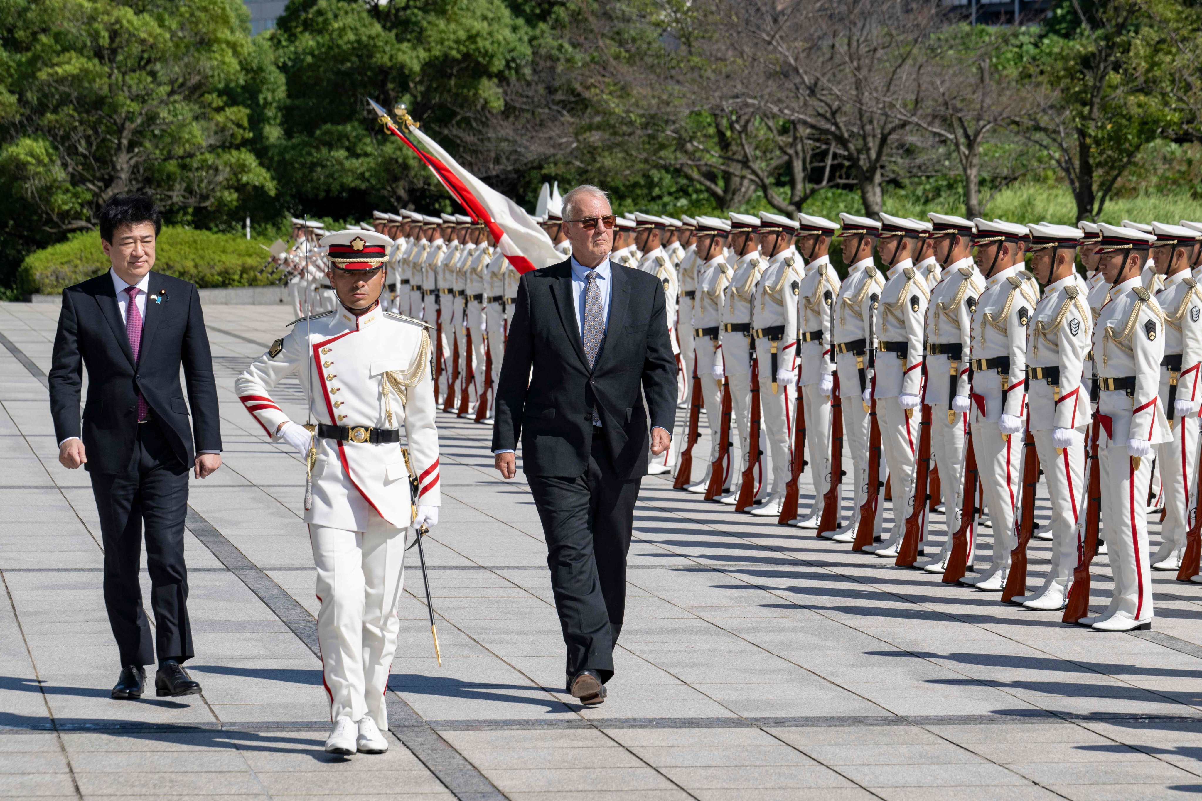 Canada’s Defence Minister Bill Blair (3rd from left) inspects an honour guard with Japan’s Defence Minister Minoru Kihara (left) in Tokyo. Photo: AFP