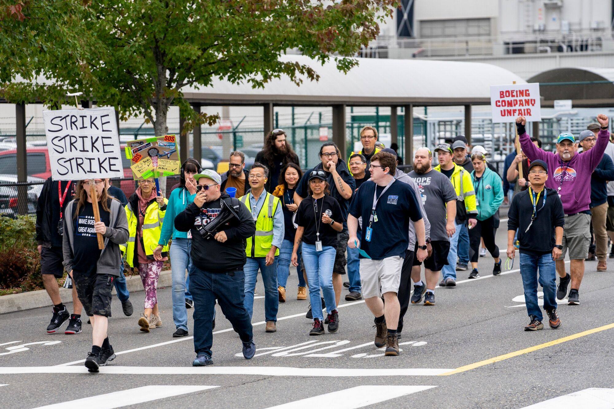 Workers walk out of the Boeing manufacturing facility in Renton, Washington, on September 12. Photo: Bloomberg