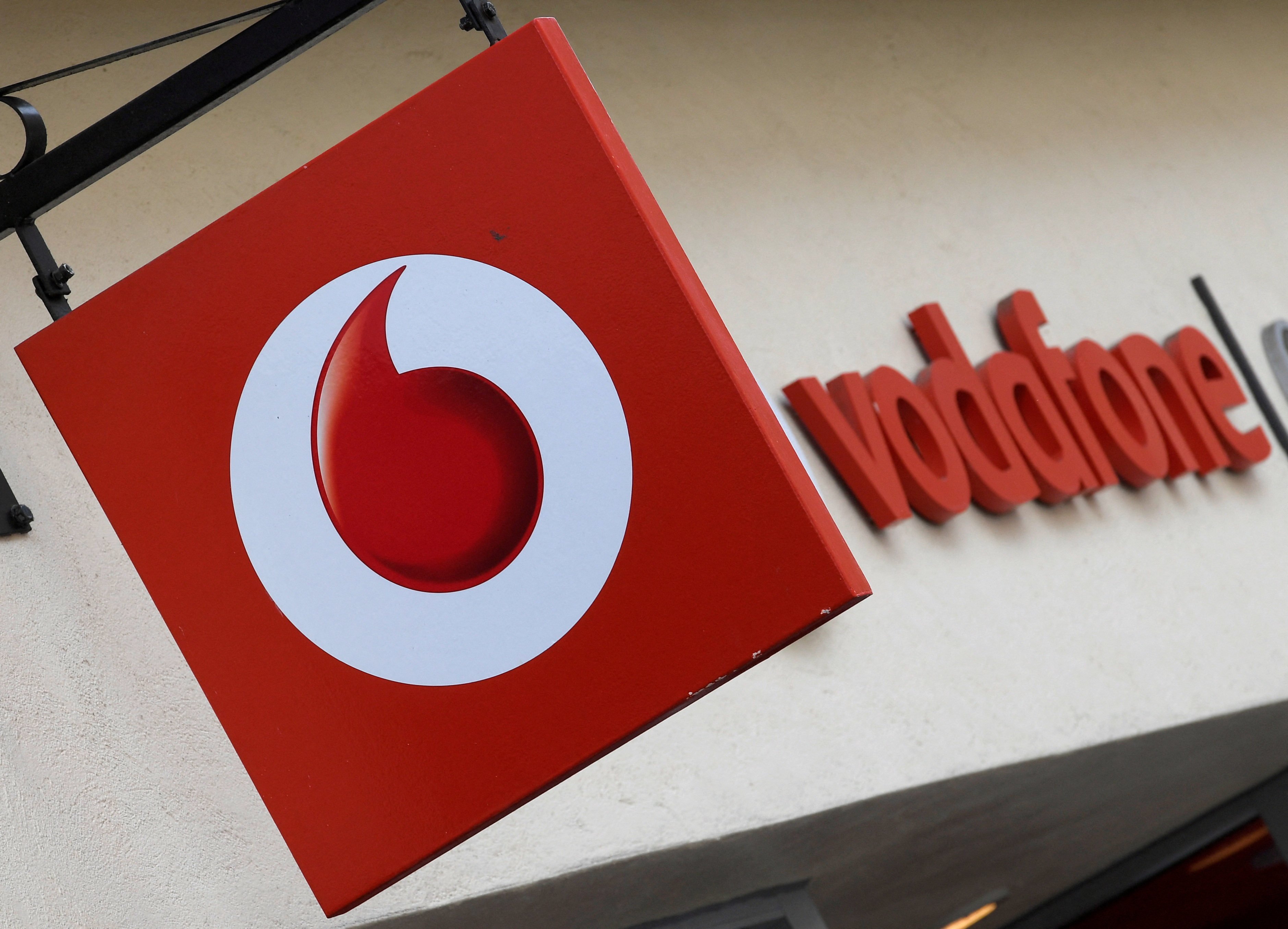 Branding hangs outside a Vodafone shop in Oxford, UK. Photo: Reuters