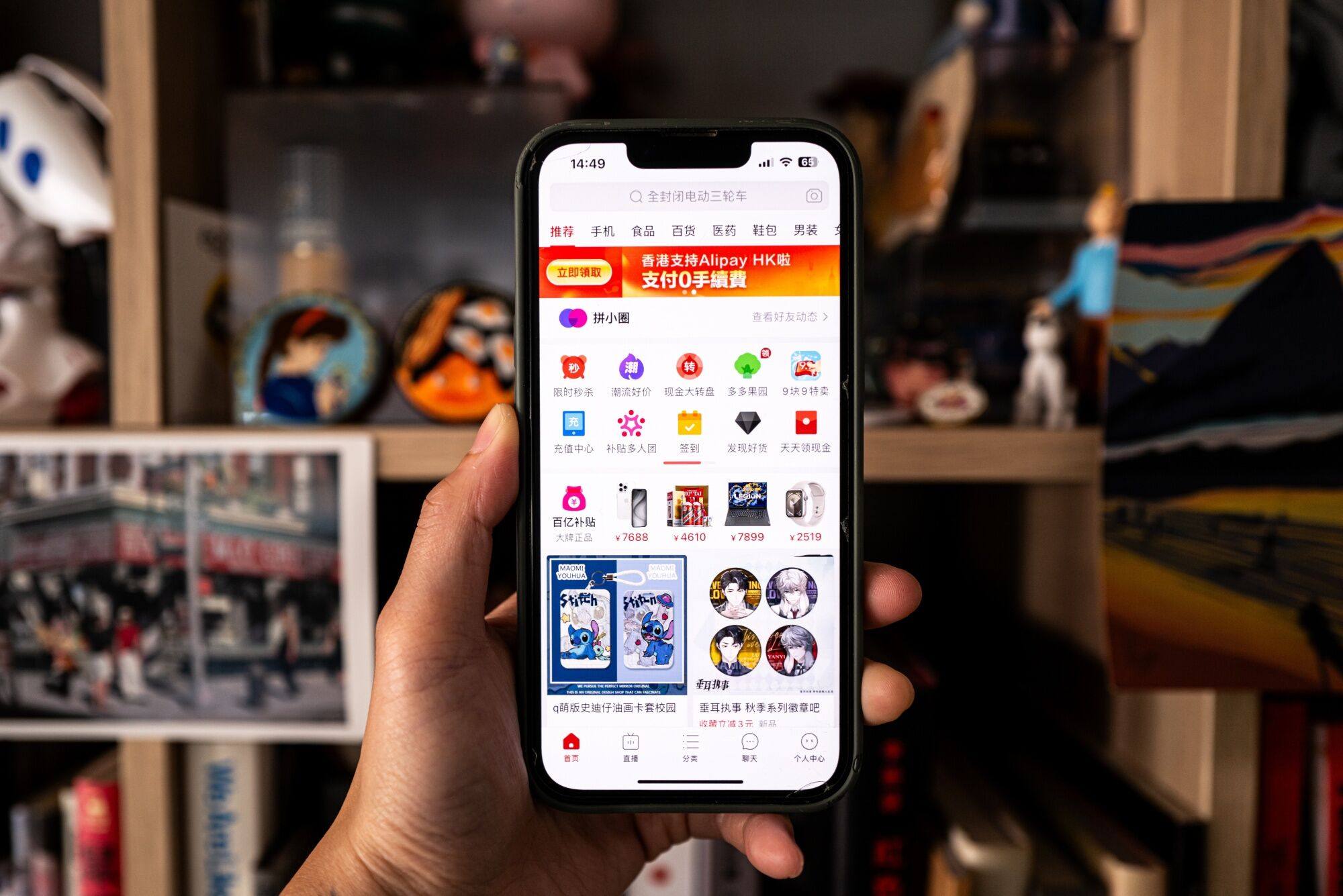 A shopper looks at the Temu app. E-commerce platforms like Temu and Shopee offer affordability with just a few clicks. Photo: Bloomberg