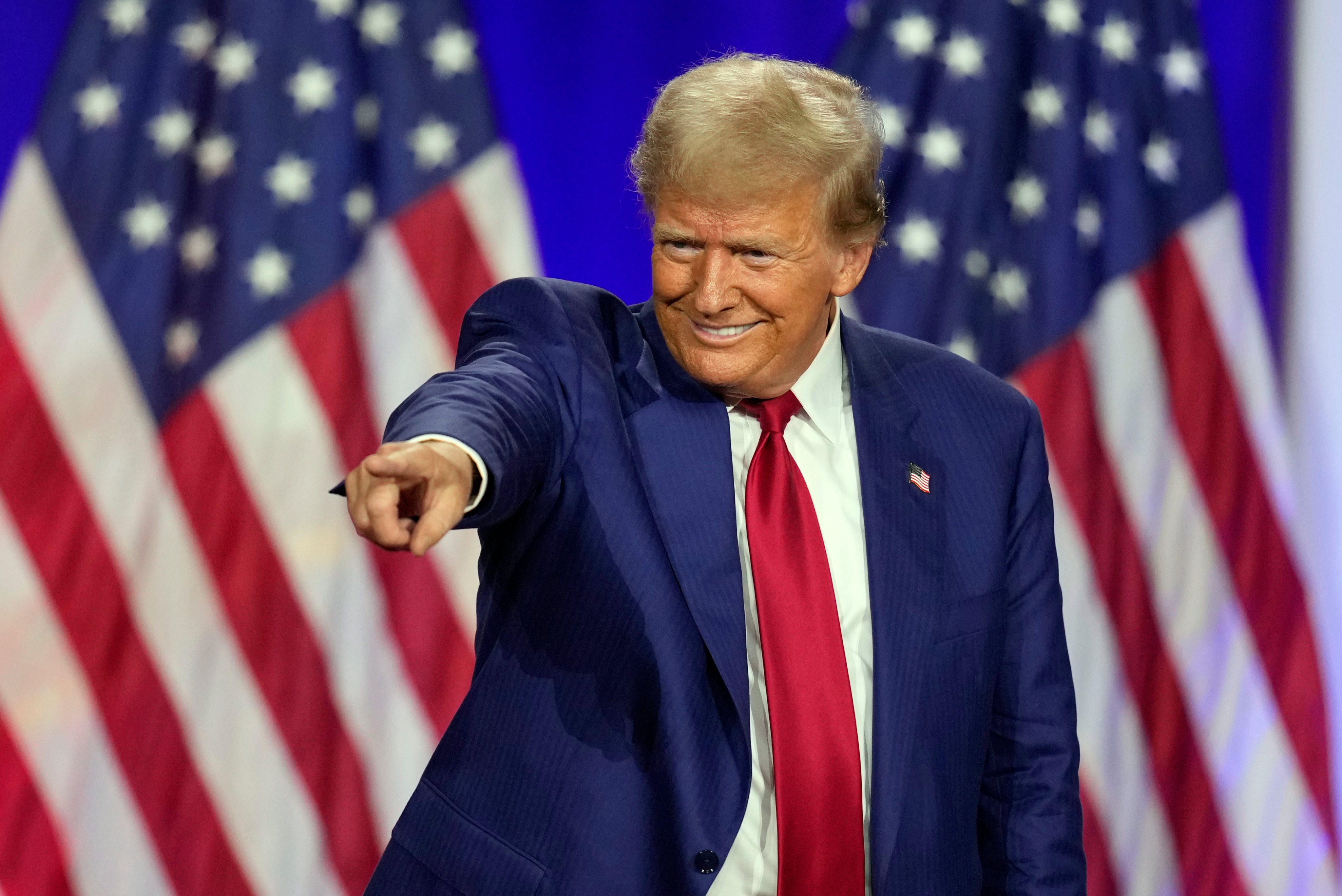 Republican presidential nominee Donald Trump points to a person in the crowd at an event in La Crosse, Wisconsin, in August. Photo: AP