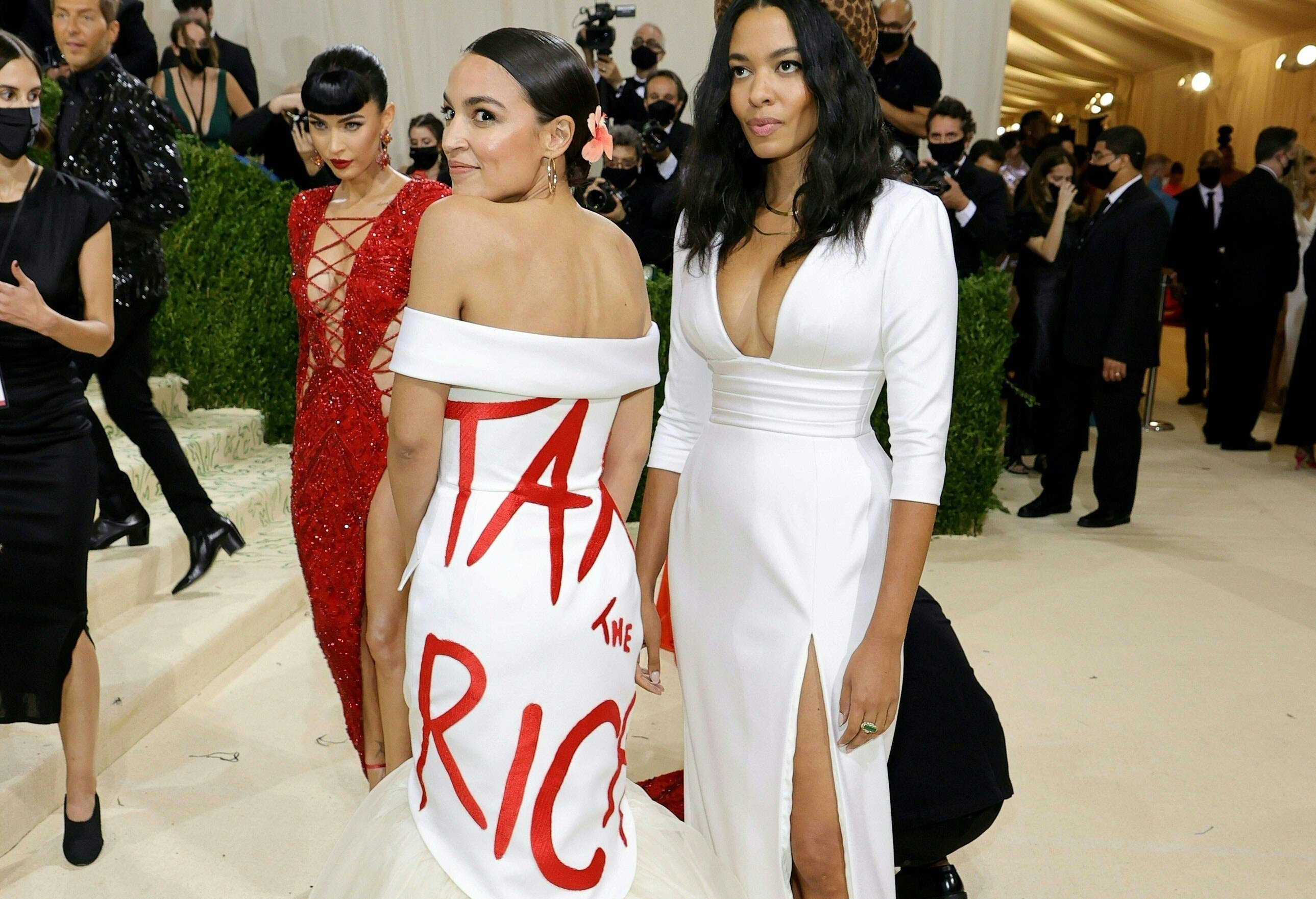 US congresswoman Alexandria Ocasio-Cortez, posing for a photo with fashion designer Aurora James, attends the Met Gala in New York City on September 13, 2021 wearing a dress printed with the words “tax the rich”. The slogan has been a rallying cry for Democrats as they seek to remake the social safety net in the US. Photo: Getty Images / AFP 