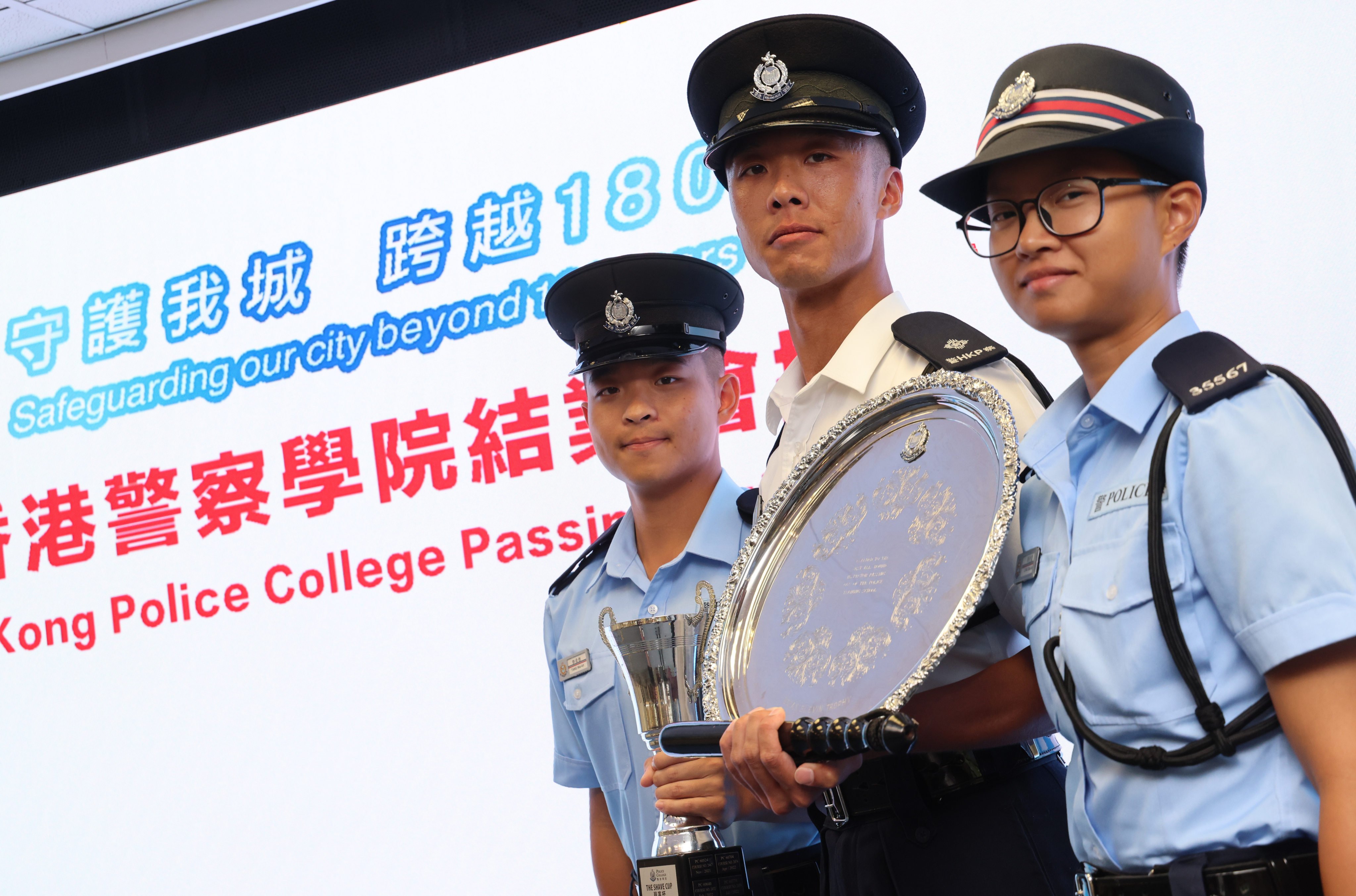 (Left to right) Constable Tang Wai-kit, Inspector Myron Lam and Constable Hollis Chau attend a graduation ceremony at the Police College. Photo: Jelly Tse