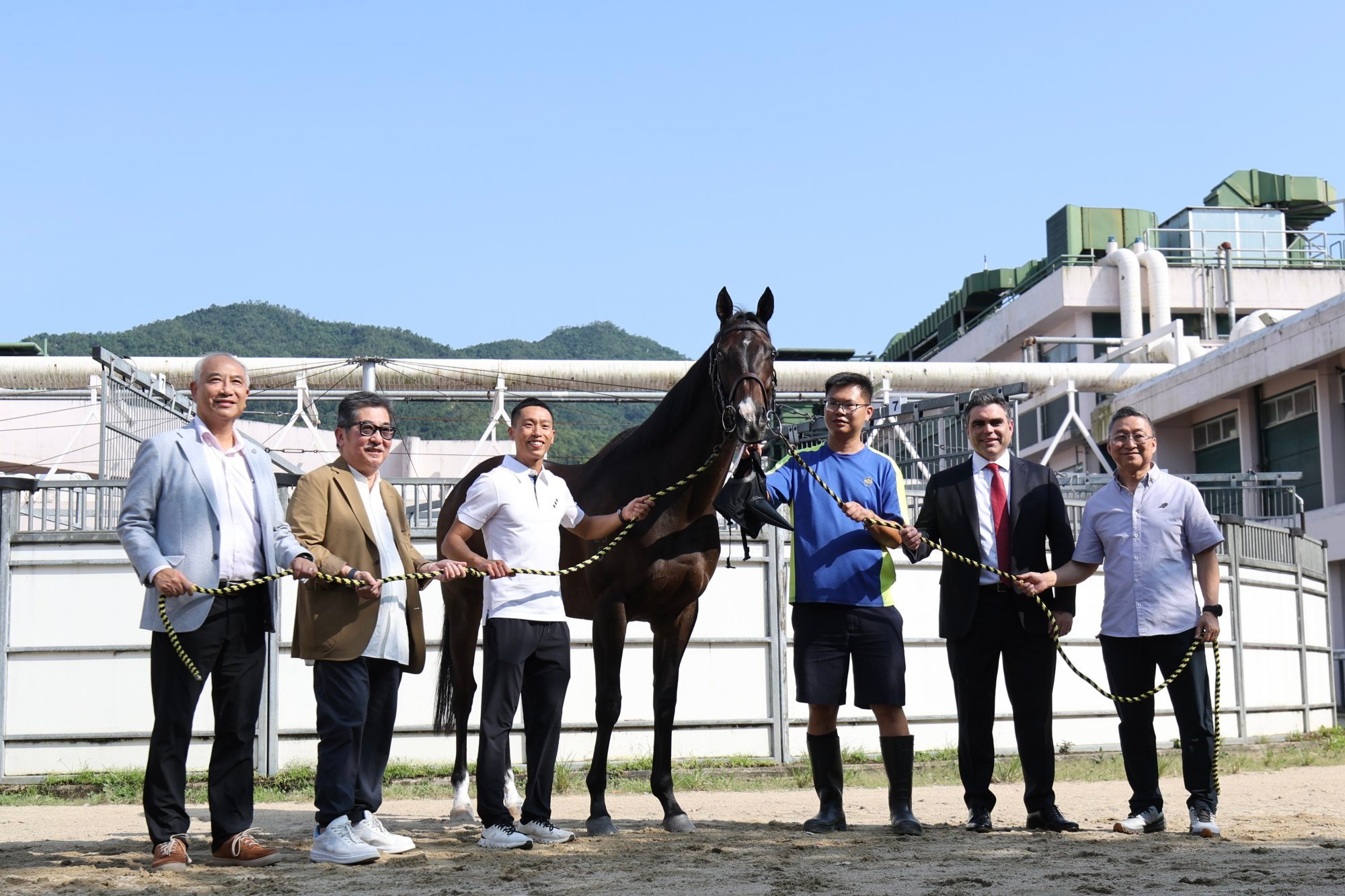 Owner Stanley Chan (second from left), jockey Vincent Ho (third from left) and trainer Francis Lui (right) with Golden Sixty at the magnificent miler’s retirement announcement on Friday. Photo: HKJC