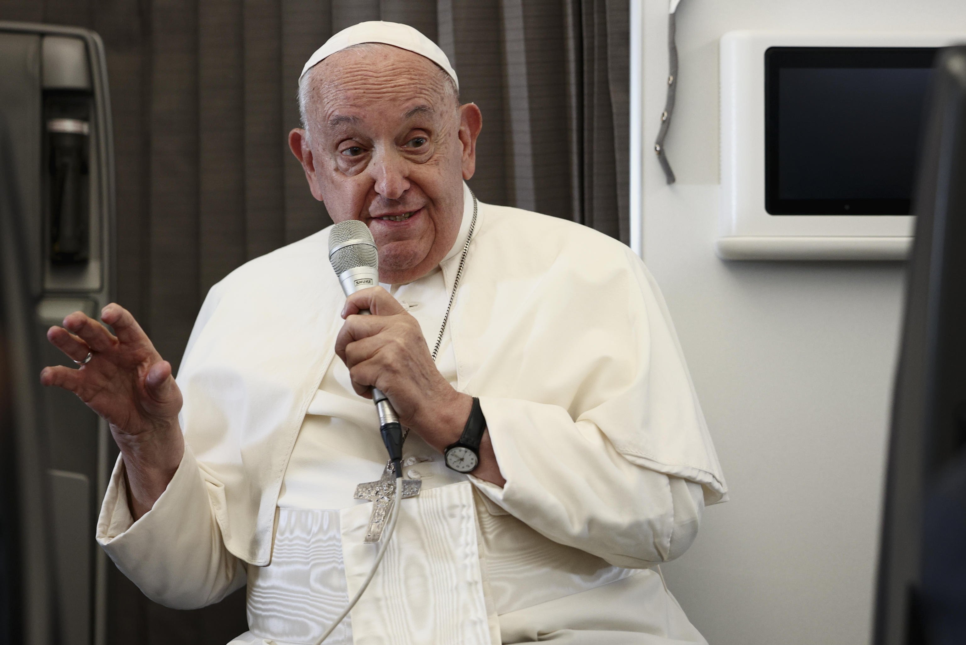 Pope Francis speaks during a news conference aboard the papal plane on his flight back after his 12-day journey across Southeast Asia and Oceania on Friday. Photo: EPA-EFE