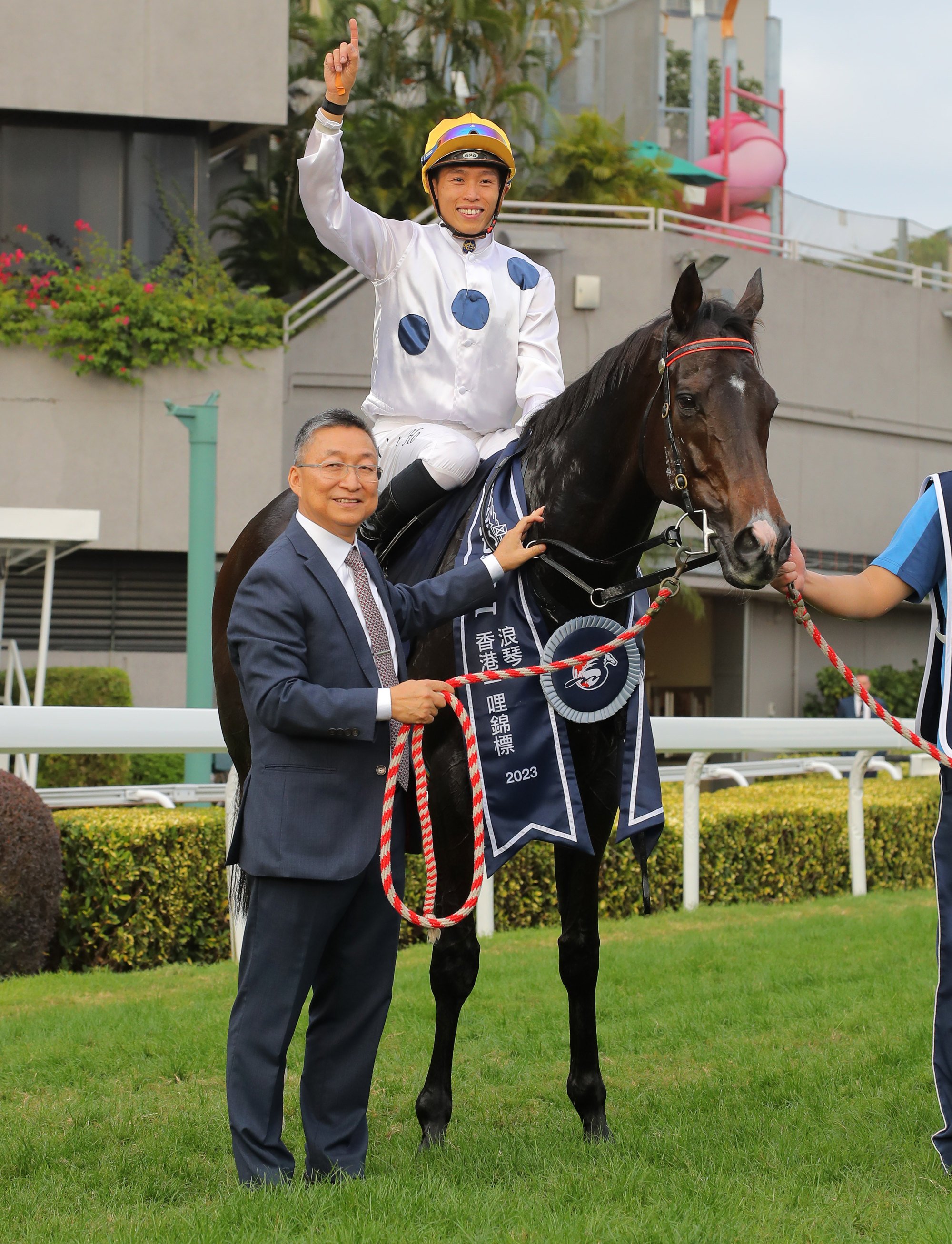 Trainer Francis Lui and jockey Vincent Ho with Golden Sixty.