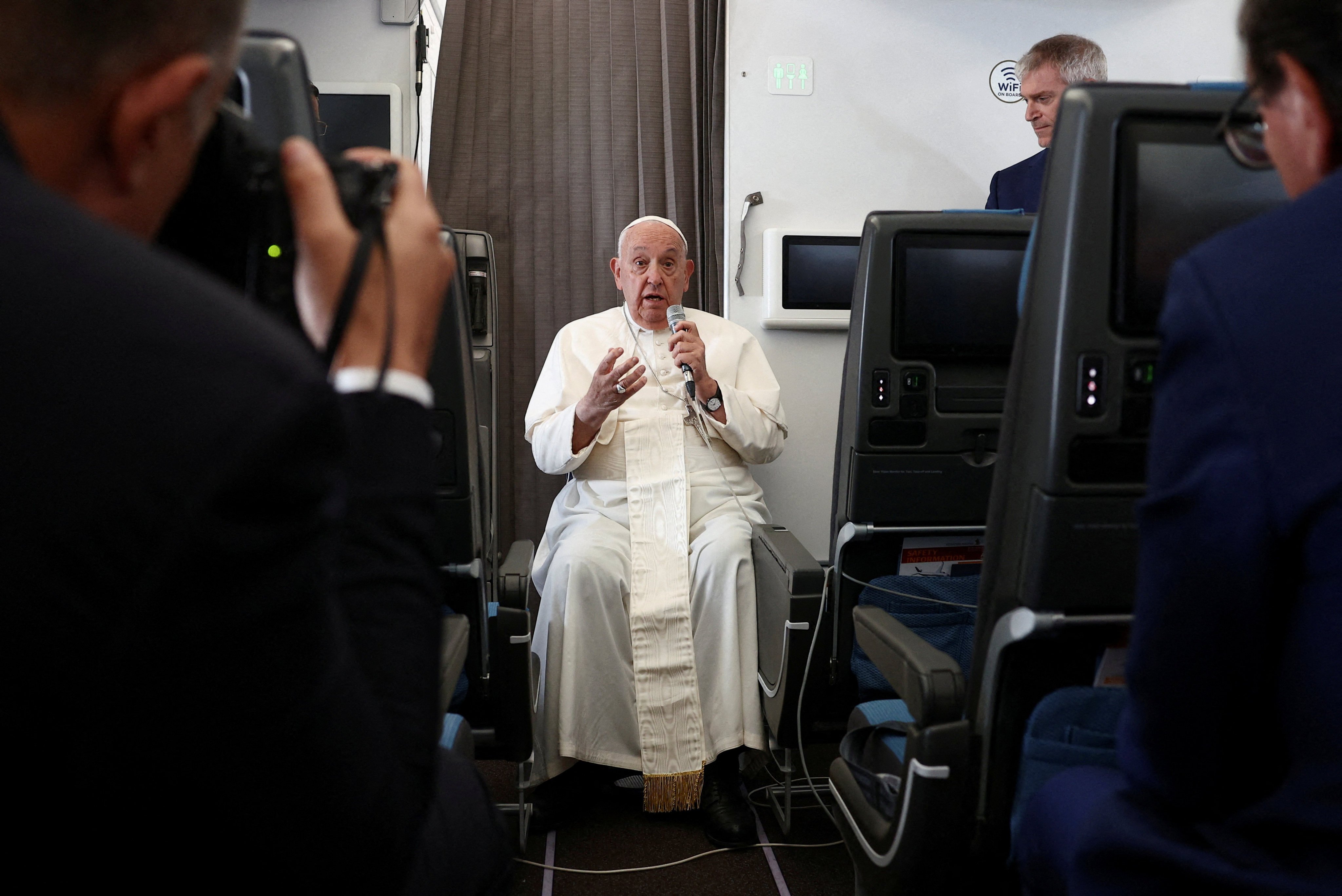 Pope Francis holds a news conference aboard the papal plane on Friday. Photo: Reuters