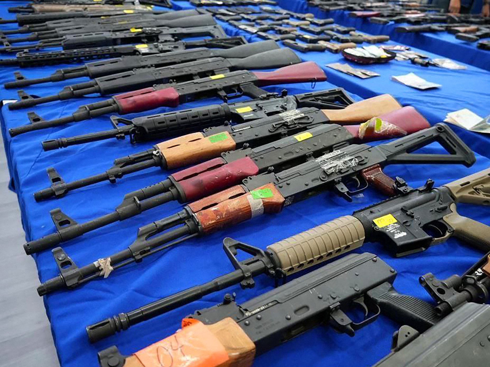 Weapons seized by Venezuelan authorities displayed at a press conference. Six foreigners have been detained in Venezuela on suspicion of plotting to attack President Nicolas Maduro. Photo: AFP