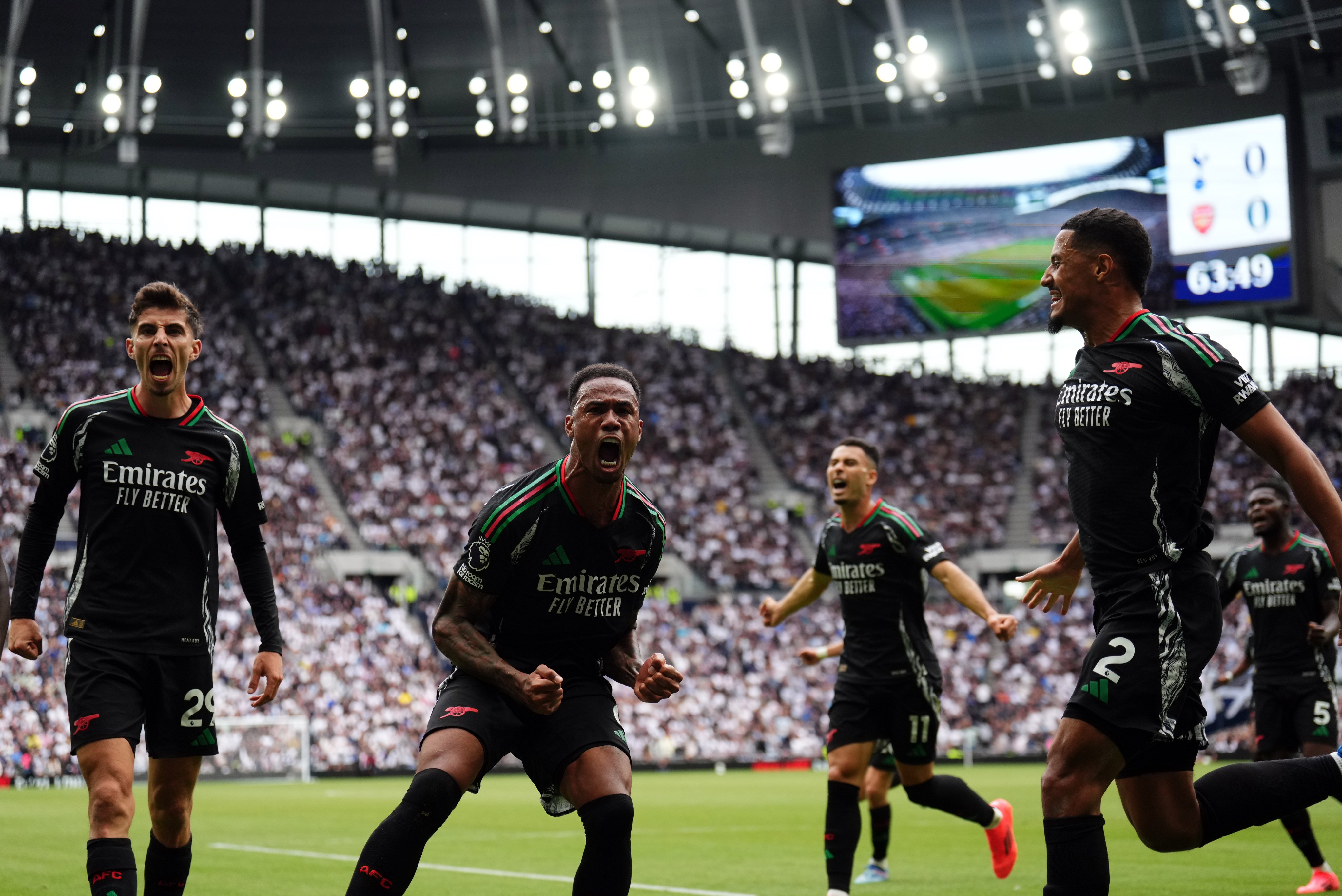 Arsenal’s Gabriel (centre) celebrates scoring his side’s winner against  Tottenham. Photo: DPA