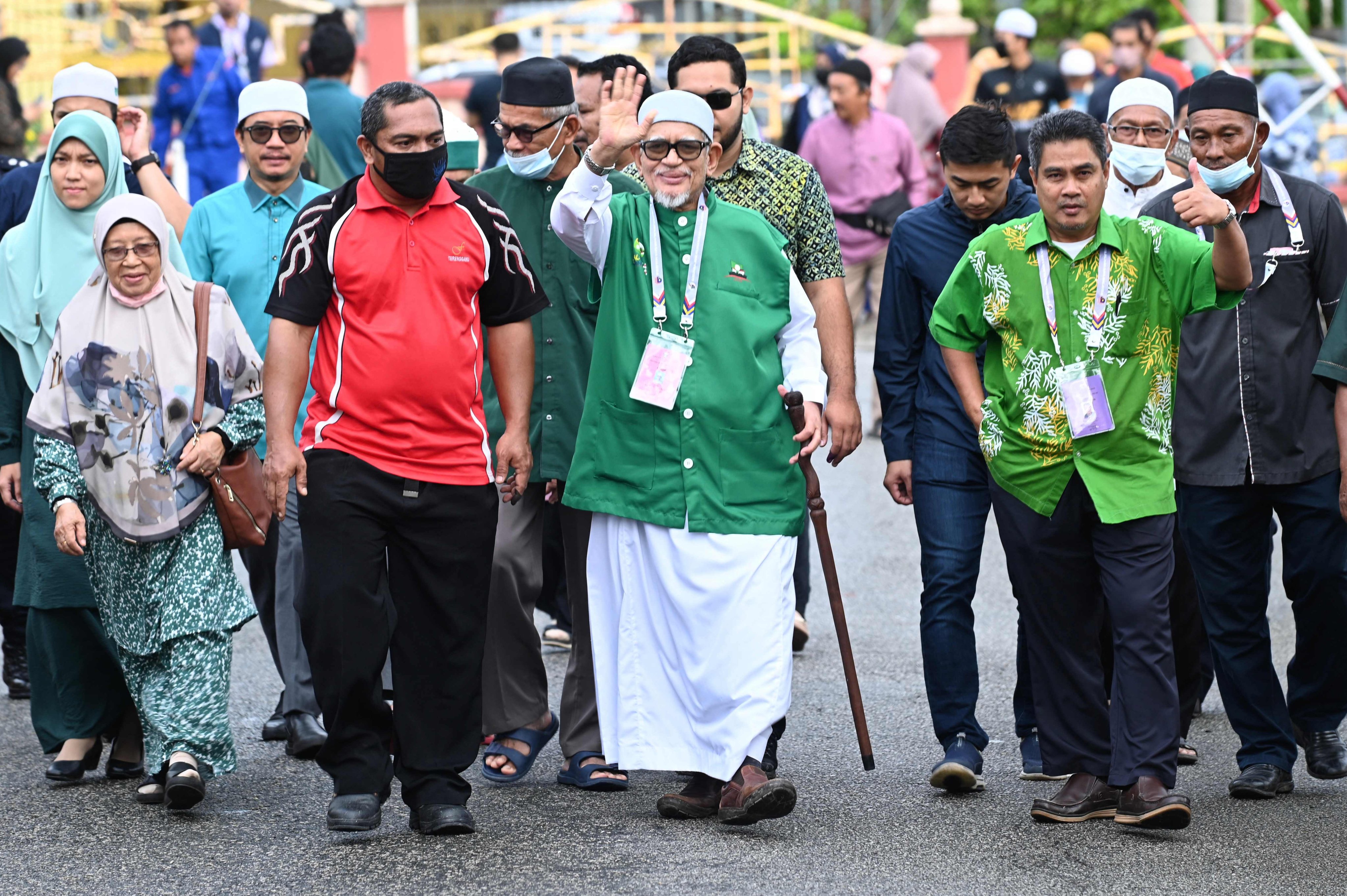 Malaysian Islamic Party (PAS) president Abdul Hadi Awang (C) waving during the 2022 general election in Marang, Malaysia’s Terengganu state. Photo: AFP / Malaysia’s Department of Information 