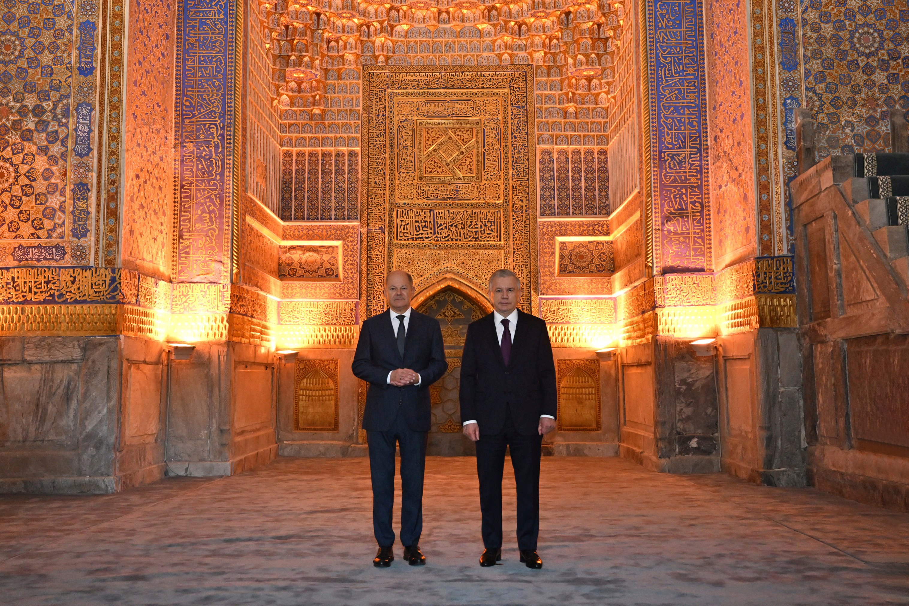 Uzbekistan’s President Shavkat Mirziyoyev, right, and German Chancellor Olaf Scholz inside the Tilya-Kori Madrasah as they visit the Registan in Samarkand, Uzbekistan on Sunday. Photo: Uzbekistan’s Presidential Press Office via AP