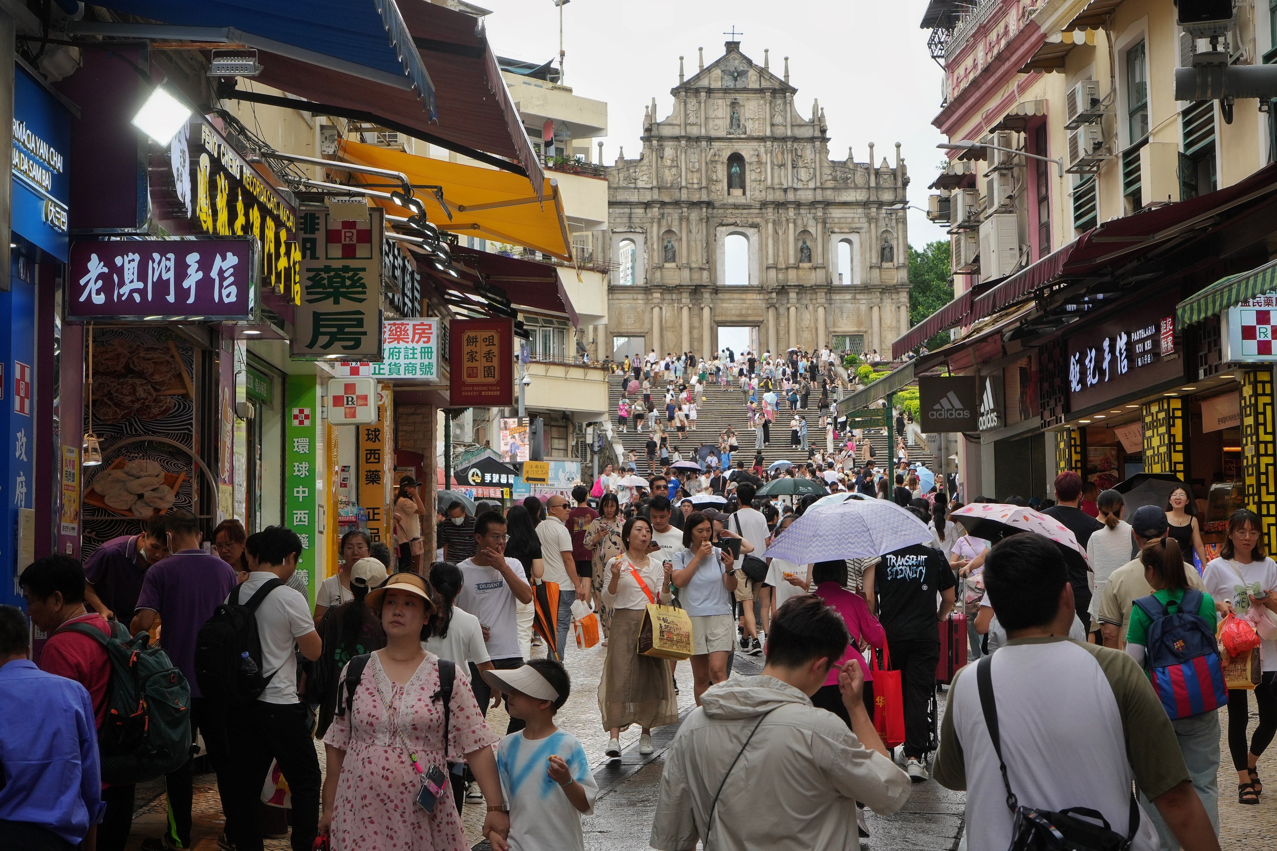 Tourists at the Ruins of St. Paul, one of the iconic tourist attractions in Macau, on 3 July 2024. Photo: Elson Li.