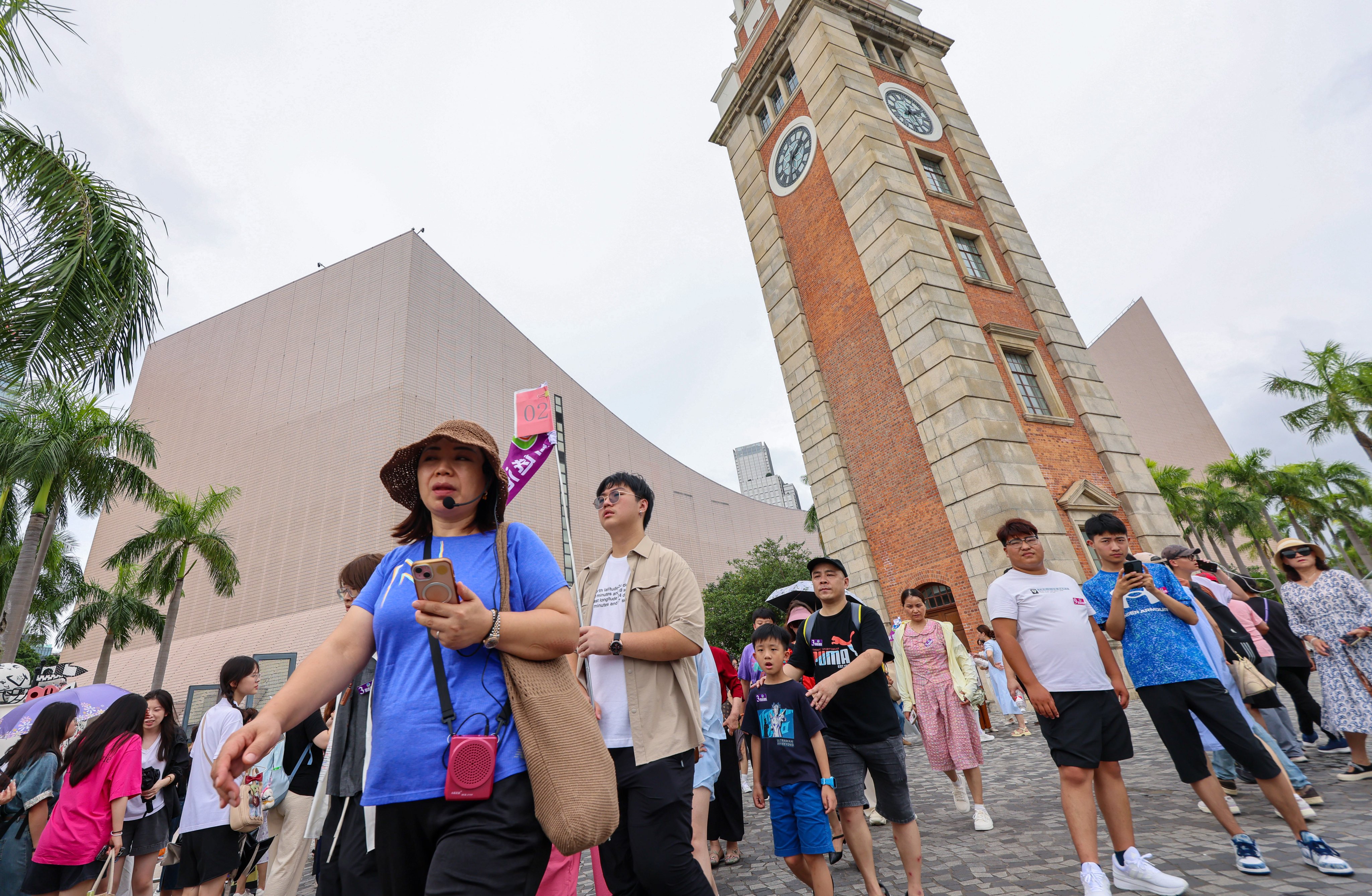 Visitors tour the Tsim Sha Tsui area. Hotel industry representatives have suggested moving the annual Wine and Dine Festival there. Photo: Jelly Tse