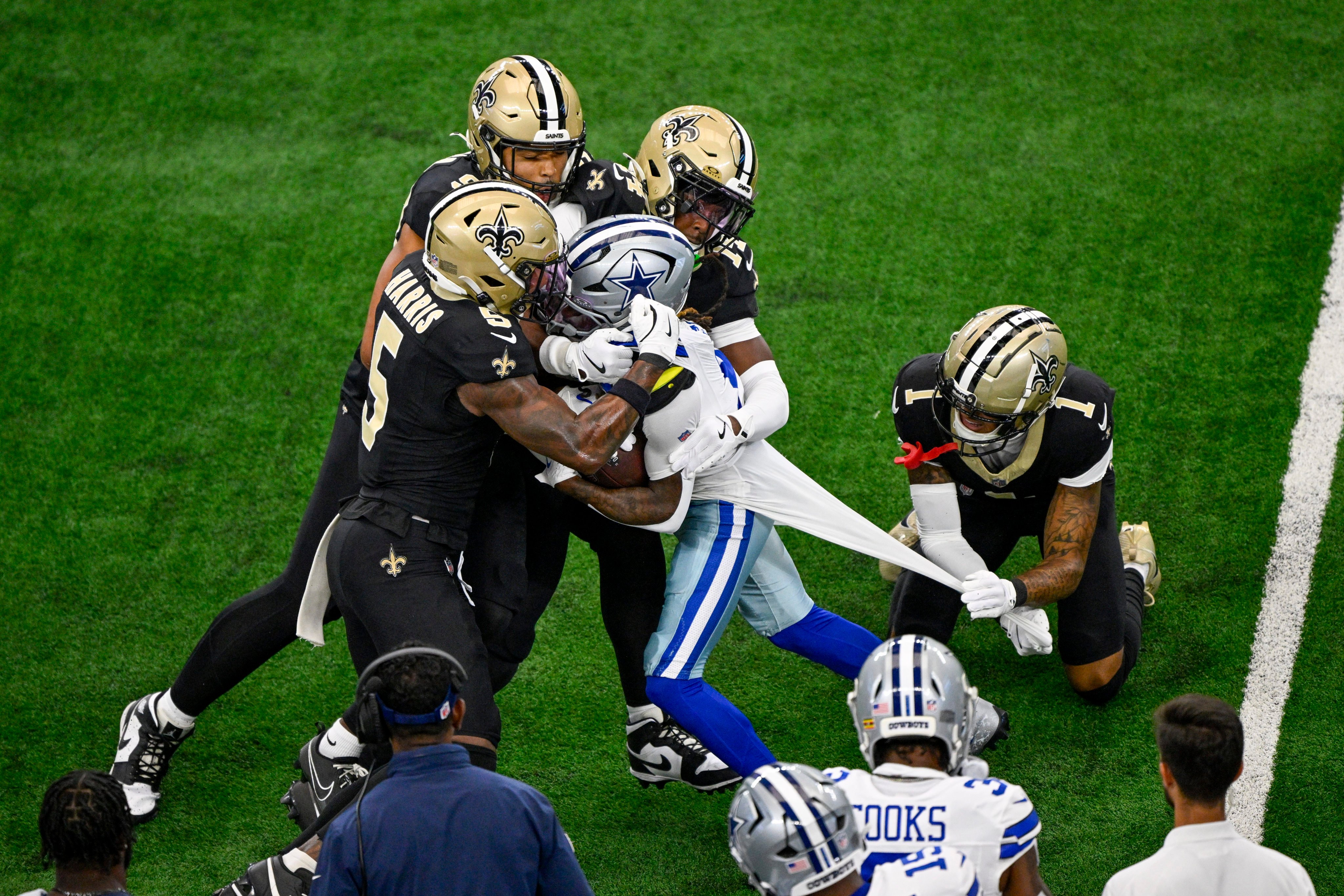 Dallas Cowboys wide receiver KaVontae Turpin, is stopped by New Orleans Saints players during the first half the game in Arlington, Texas. Photo: AP