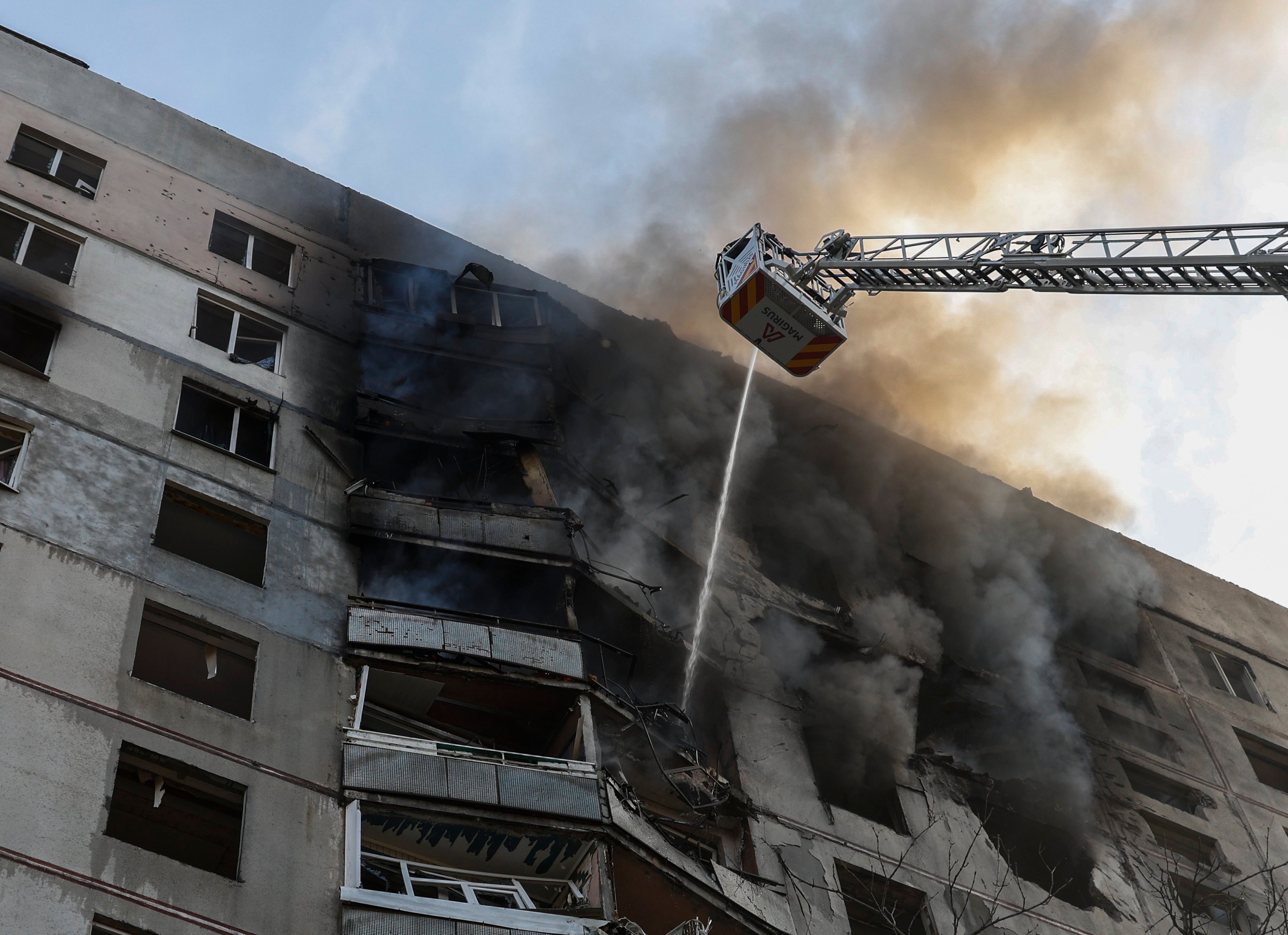 Ukrainian rescuers work at the site of a damaged residential building after shelling in Kharkiv, northeastern Ukraine, on Sunday. Photo: EPA-EFE