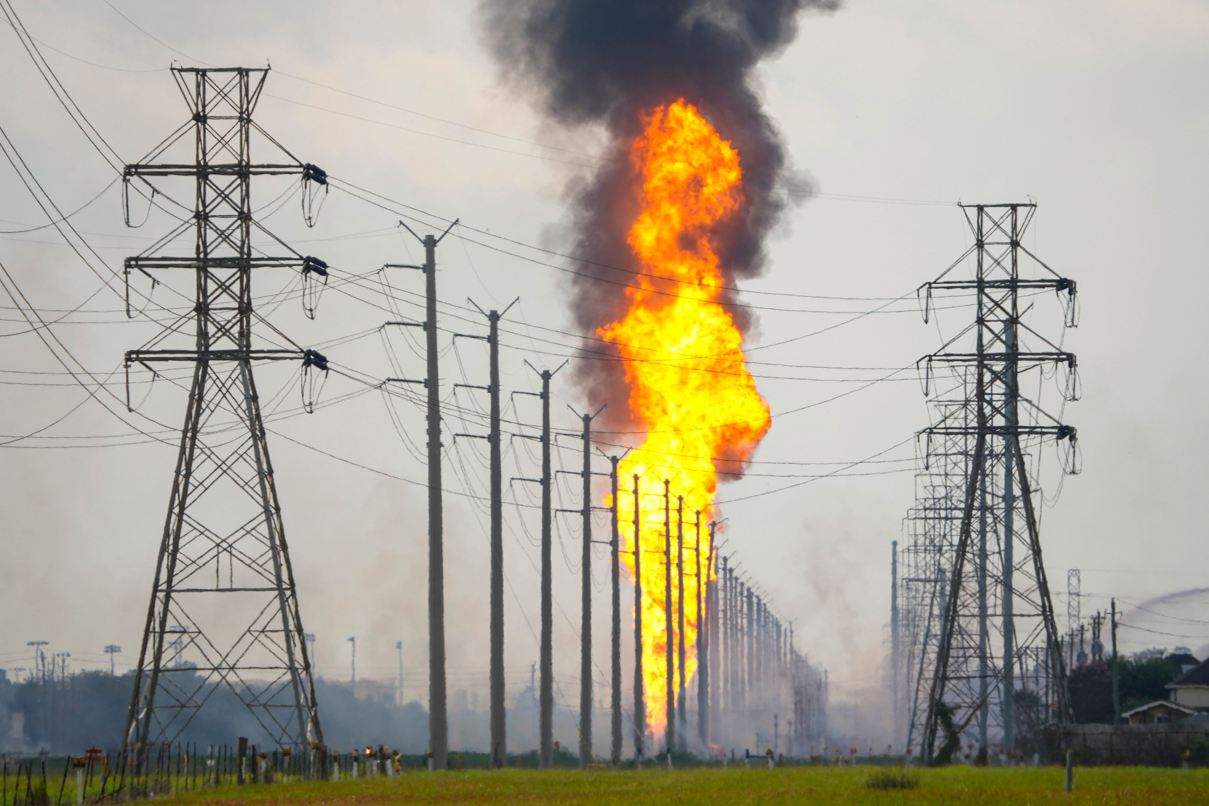 A pipeline with a giant plume of fire burns on Monday in La Porte, Houston, Texas. Photo: Houston Chronicle via AP