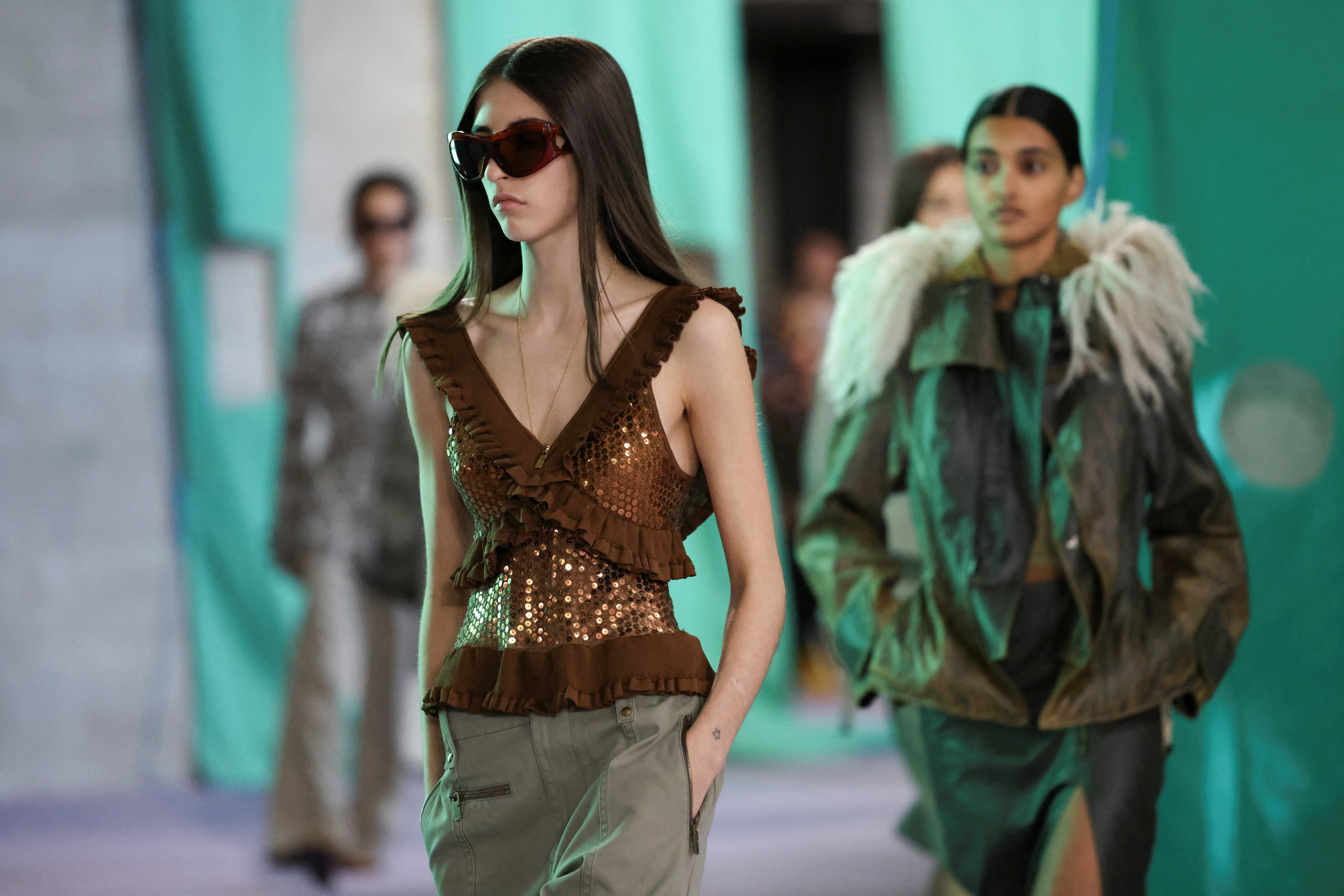 Outerwear and a touch of glamour at Burberry spring/summer 2025. Photo: Reuters