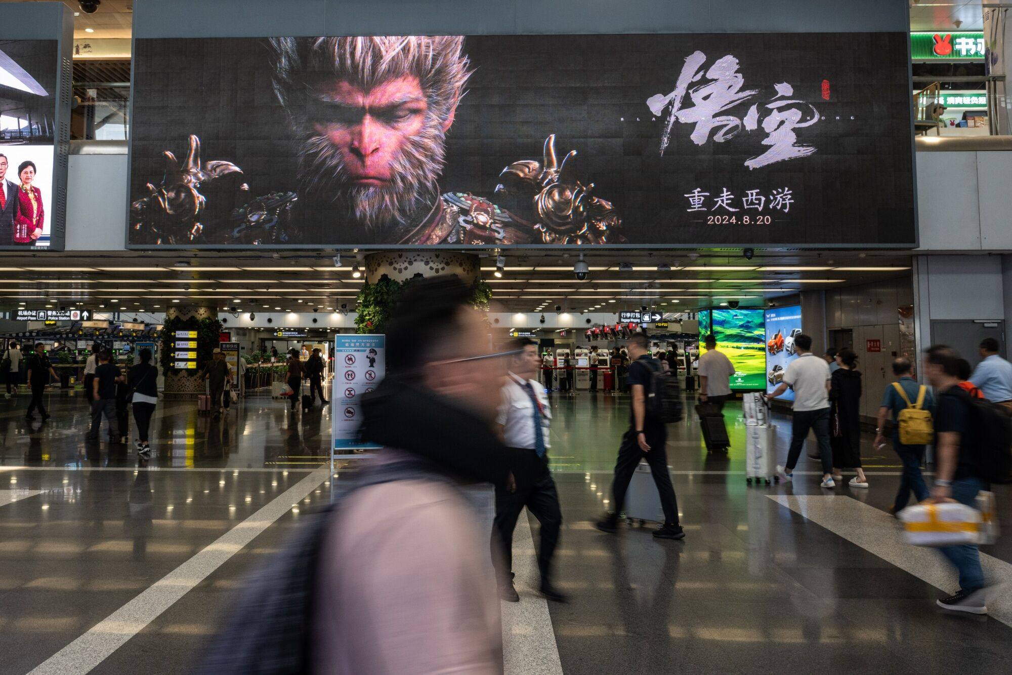 An advertisement for the hugely popular Chinese role-playing video game, Black Myth: Wukong, is seen at the Beijing Capital International Airport in Beijing on September 3. Photo:  Bloomberg