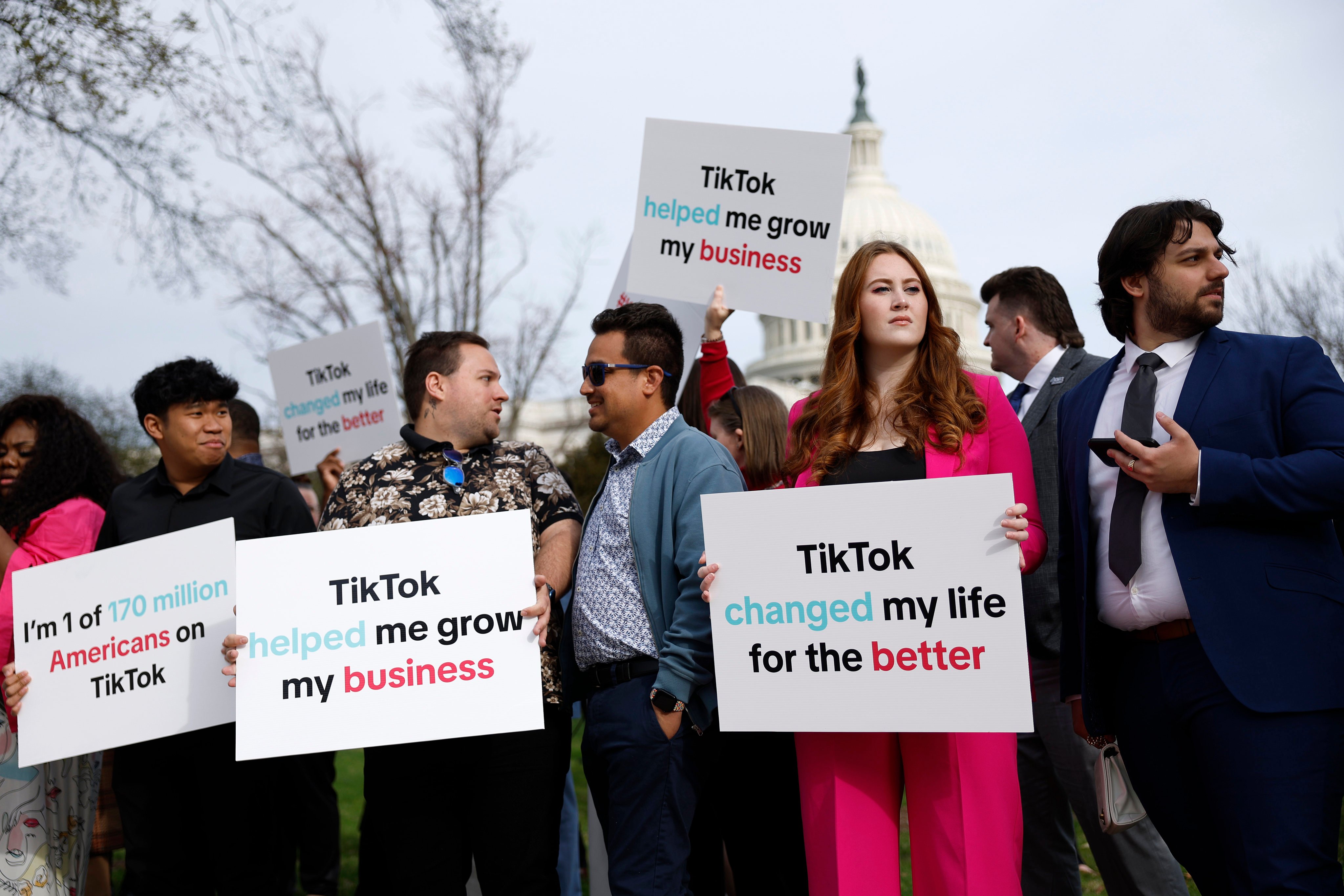 Participants hold signs in support of TikTok outside the US Capitol Building in March. Photo: Getty Images