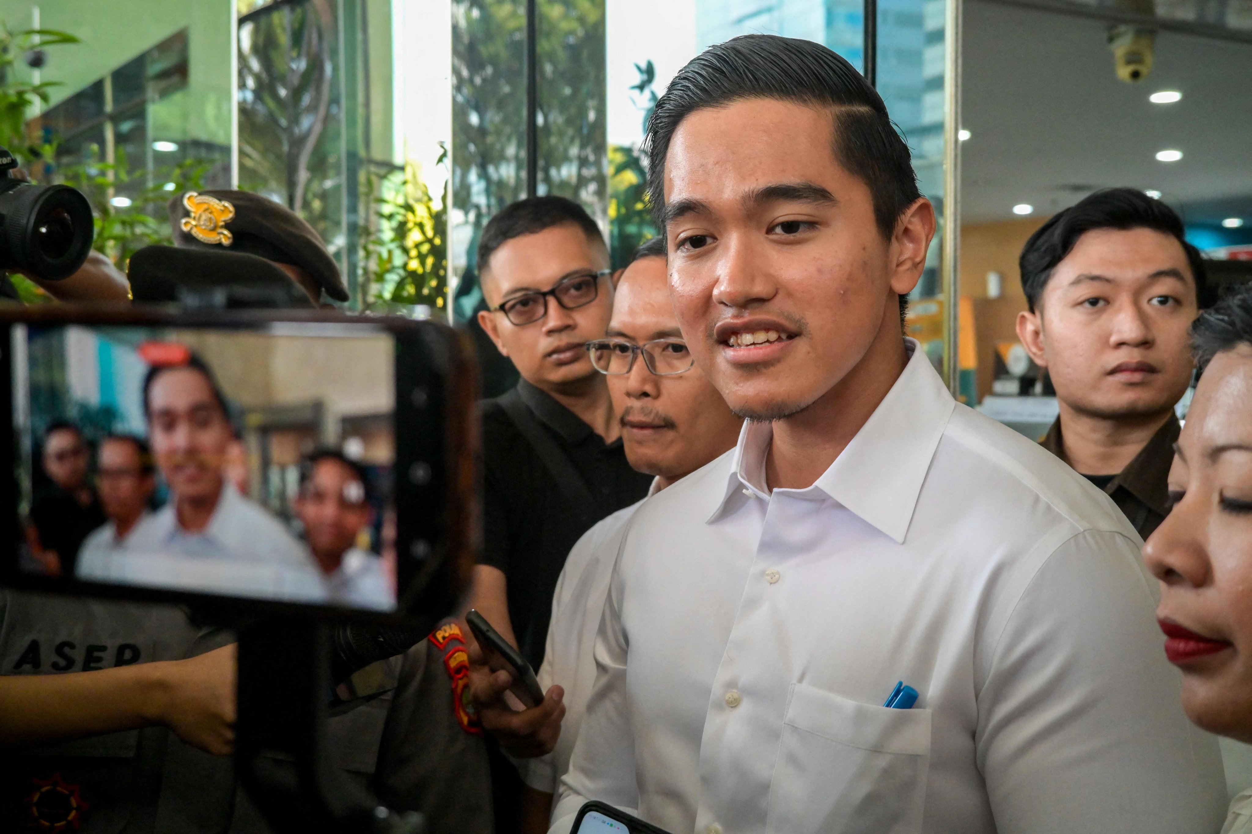 Kaesang Pangarep, the youngest son of Indonesia’s President Joko Widodo, answers questions while leaving the Corruption Eradication Commission (KPK) building in Jakarta on Tuesday. Photo: AFP