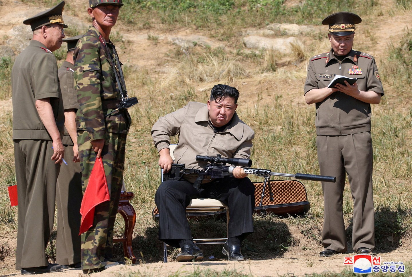 North Korean leader Kim Jong-un pictured holding a scoped rifle during a visit to a military training base this month. Photo: KCNA via Reuters